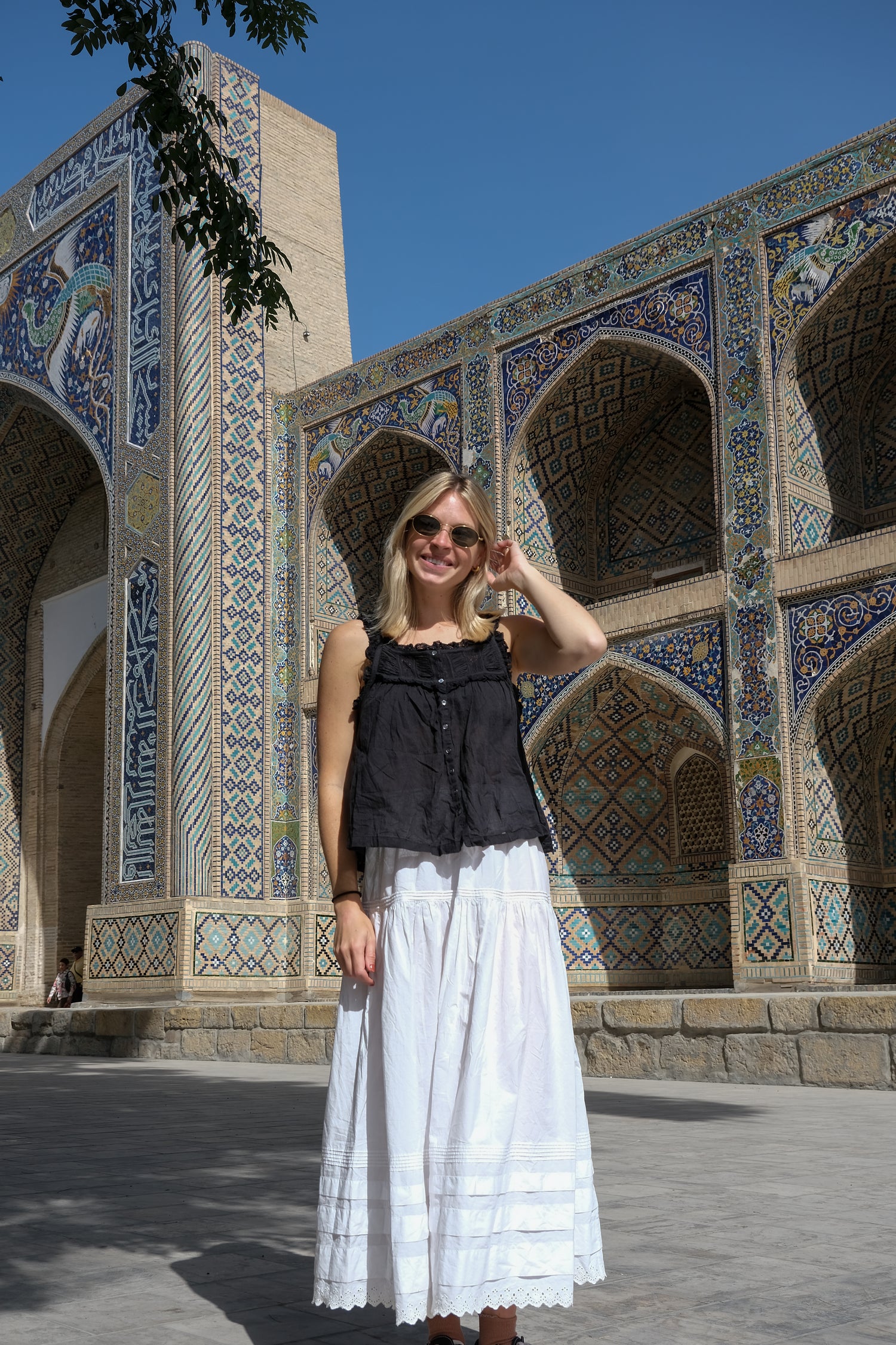 Textile sourcing trip, photo in front of decorative tiled building in Bukhara, Uzbekistan