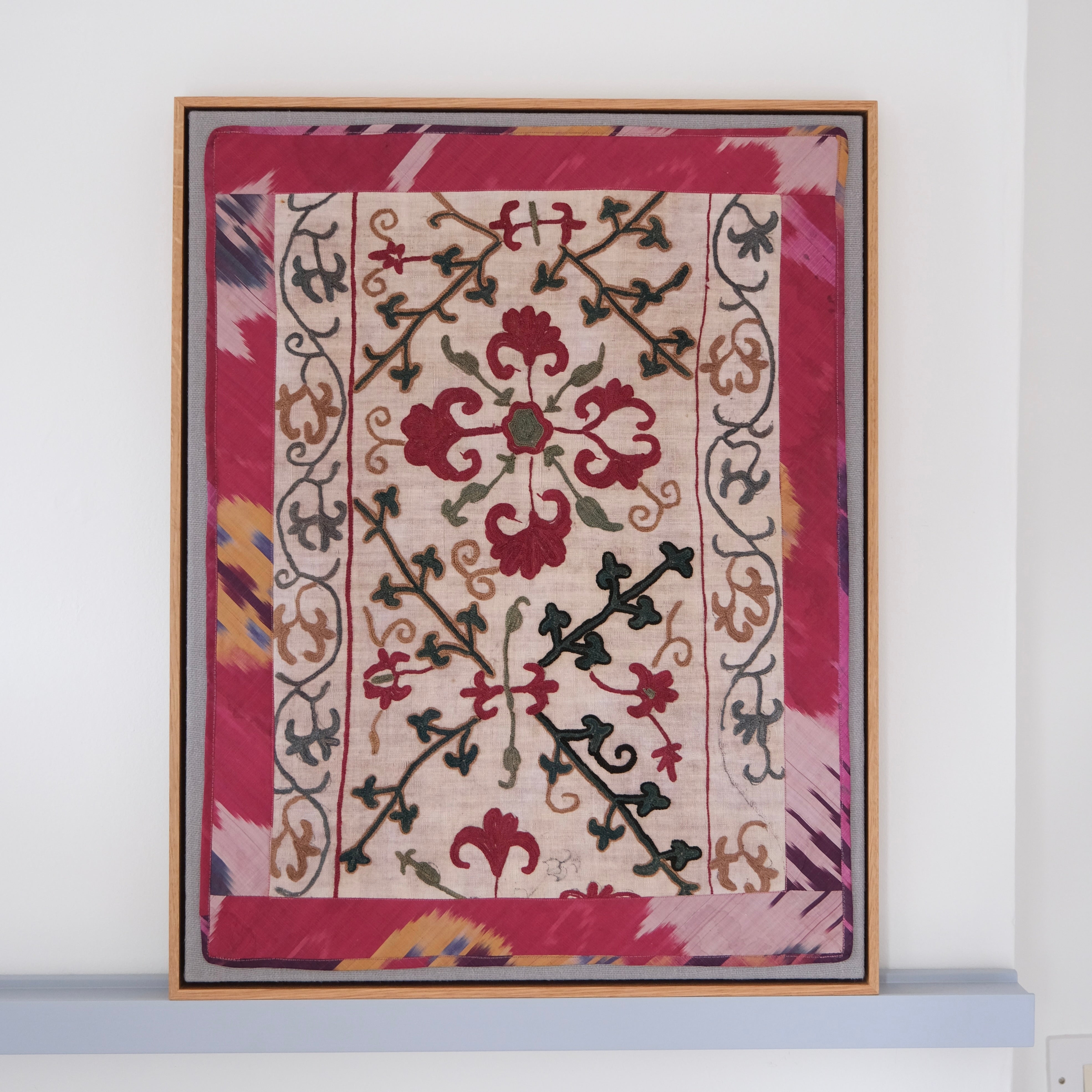 Framed antique suzani, dark pink & green