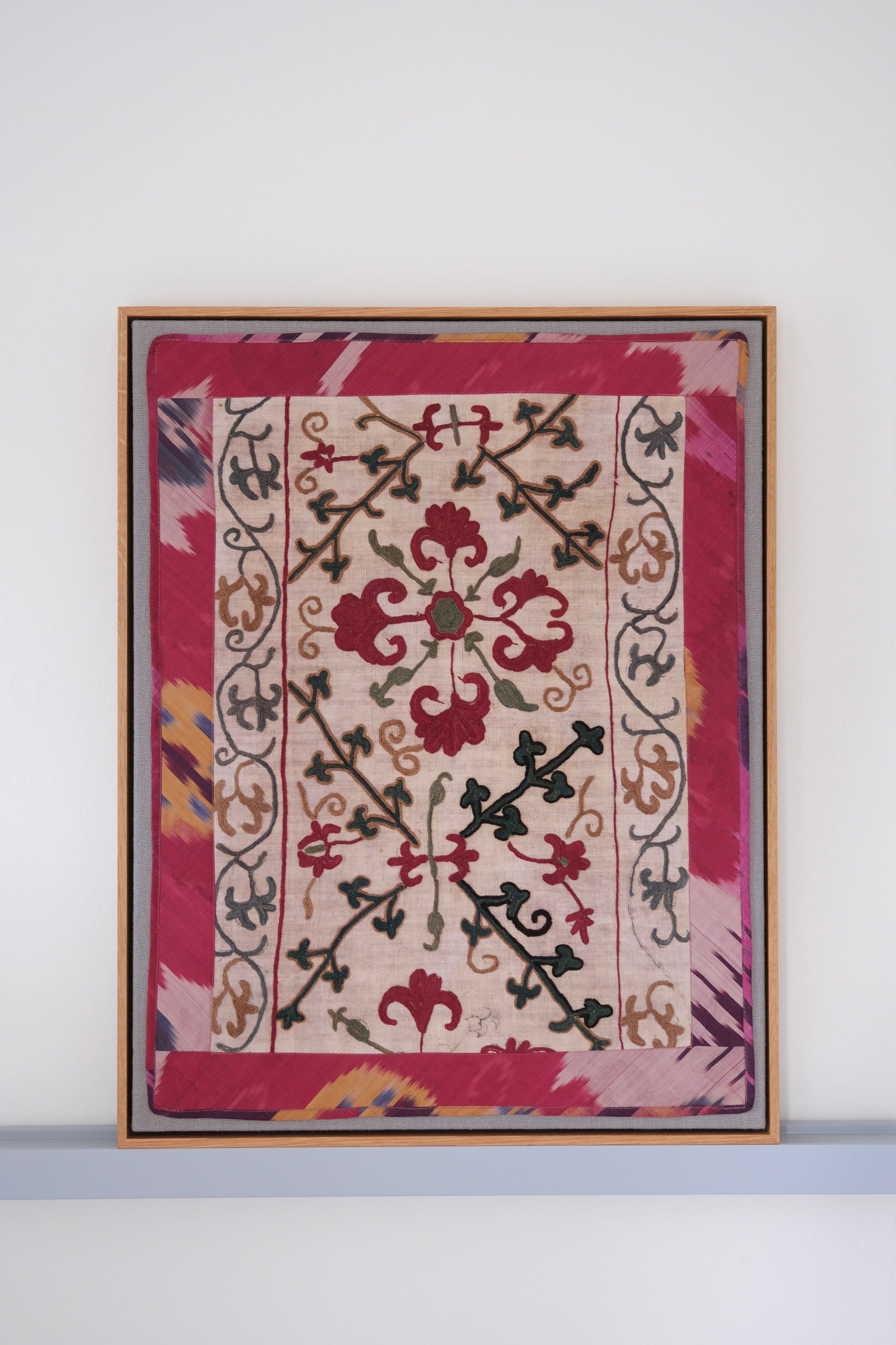 Framed antique suzani, dark pink & green
