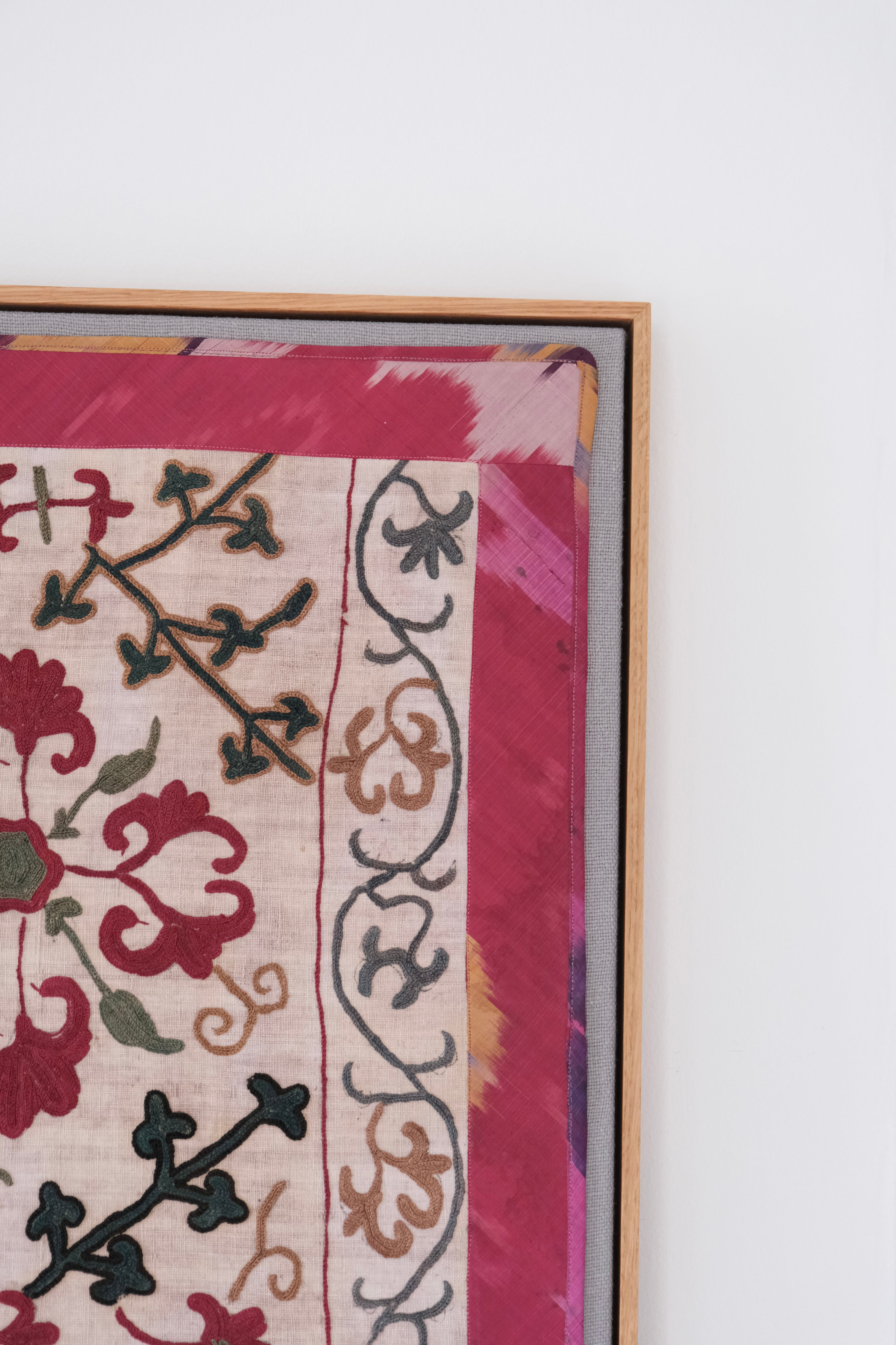 Framed antique suzani, dark pink & green