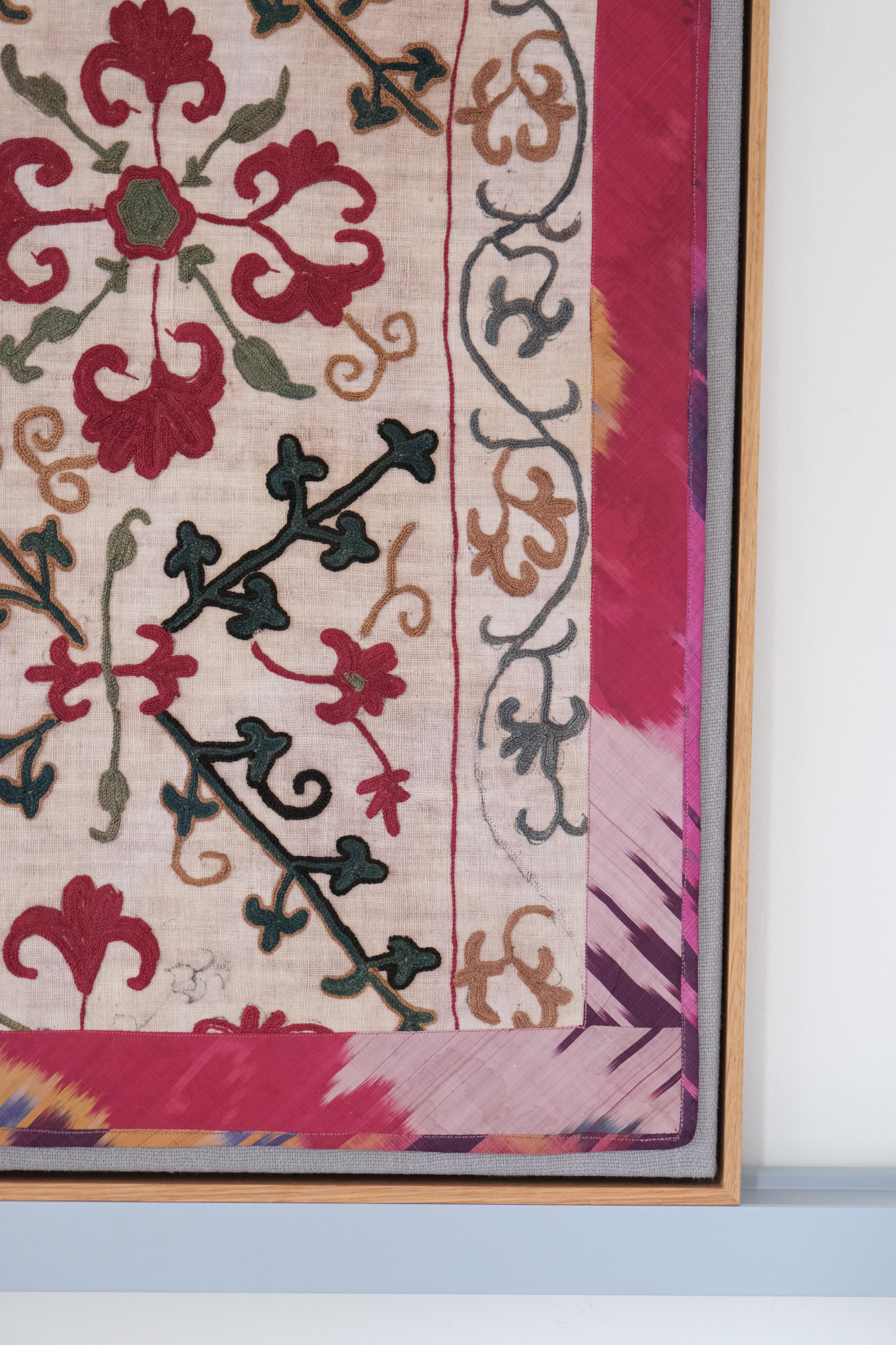 Framed antique suzani, dark pink & green