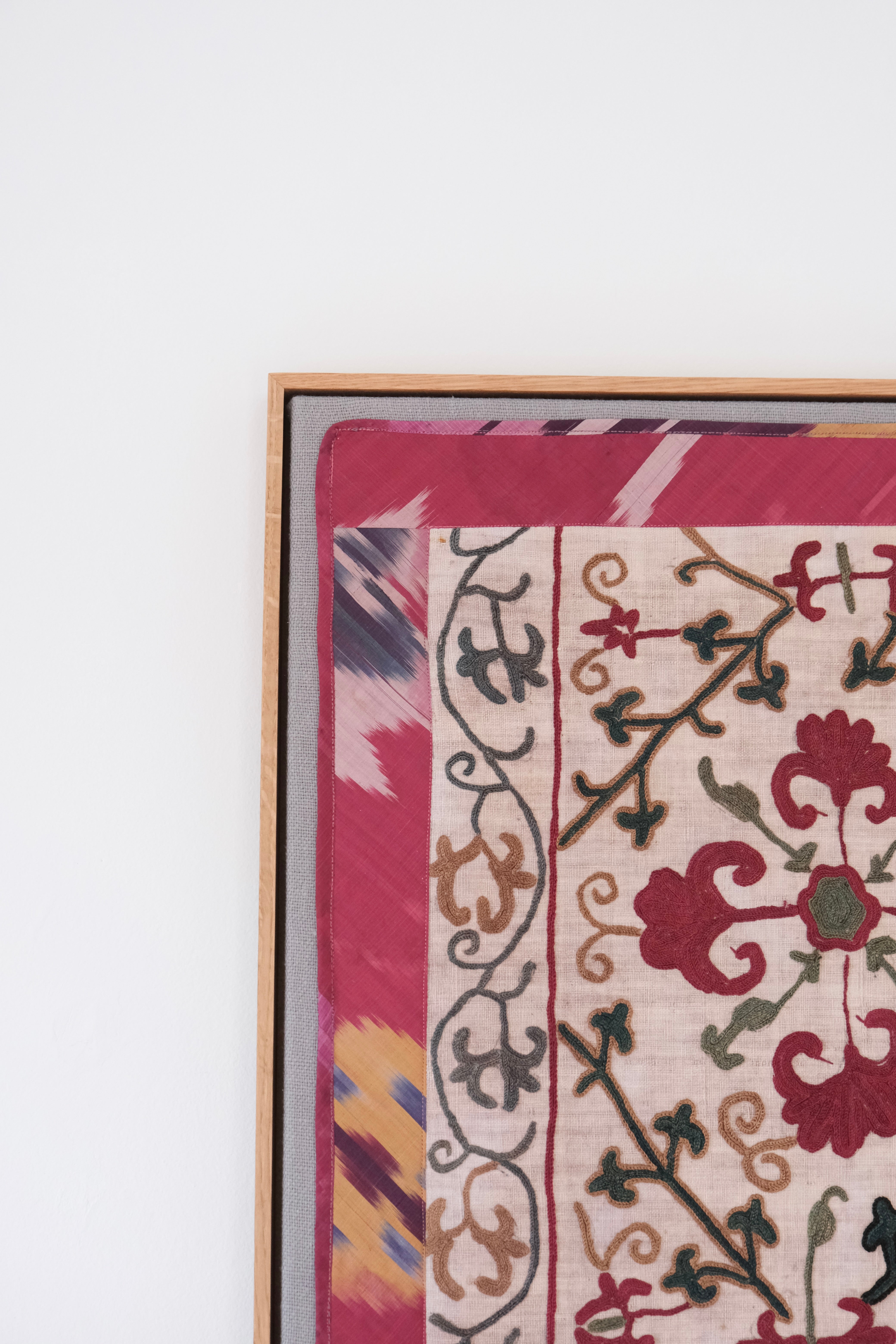 Framed antique suzani, dark pink & green
