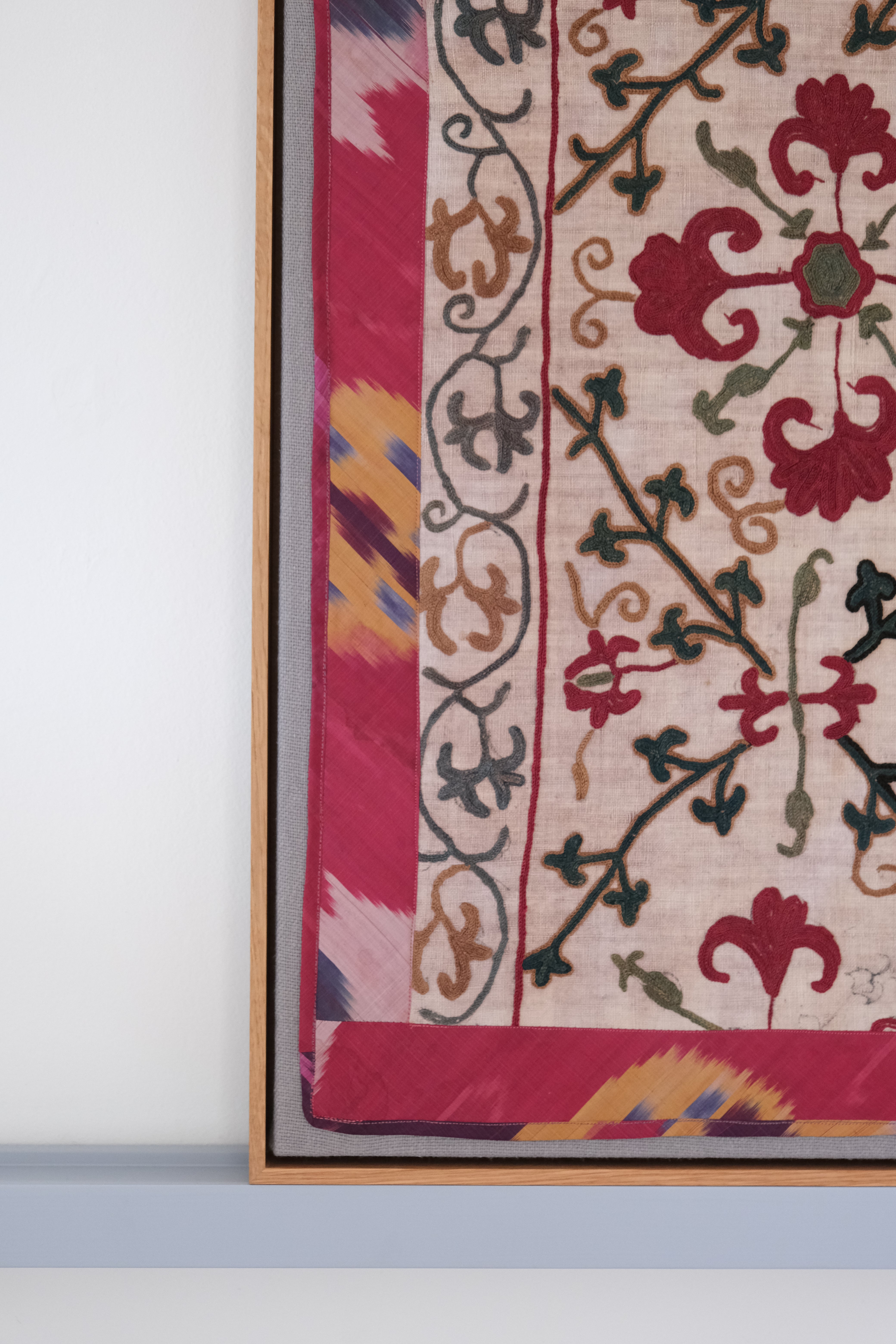 Framed antique suzani, dark pink & green
