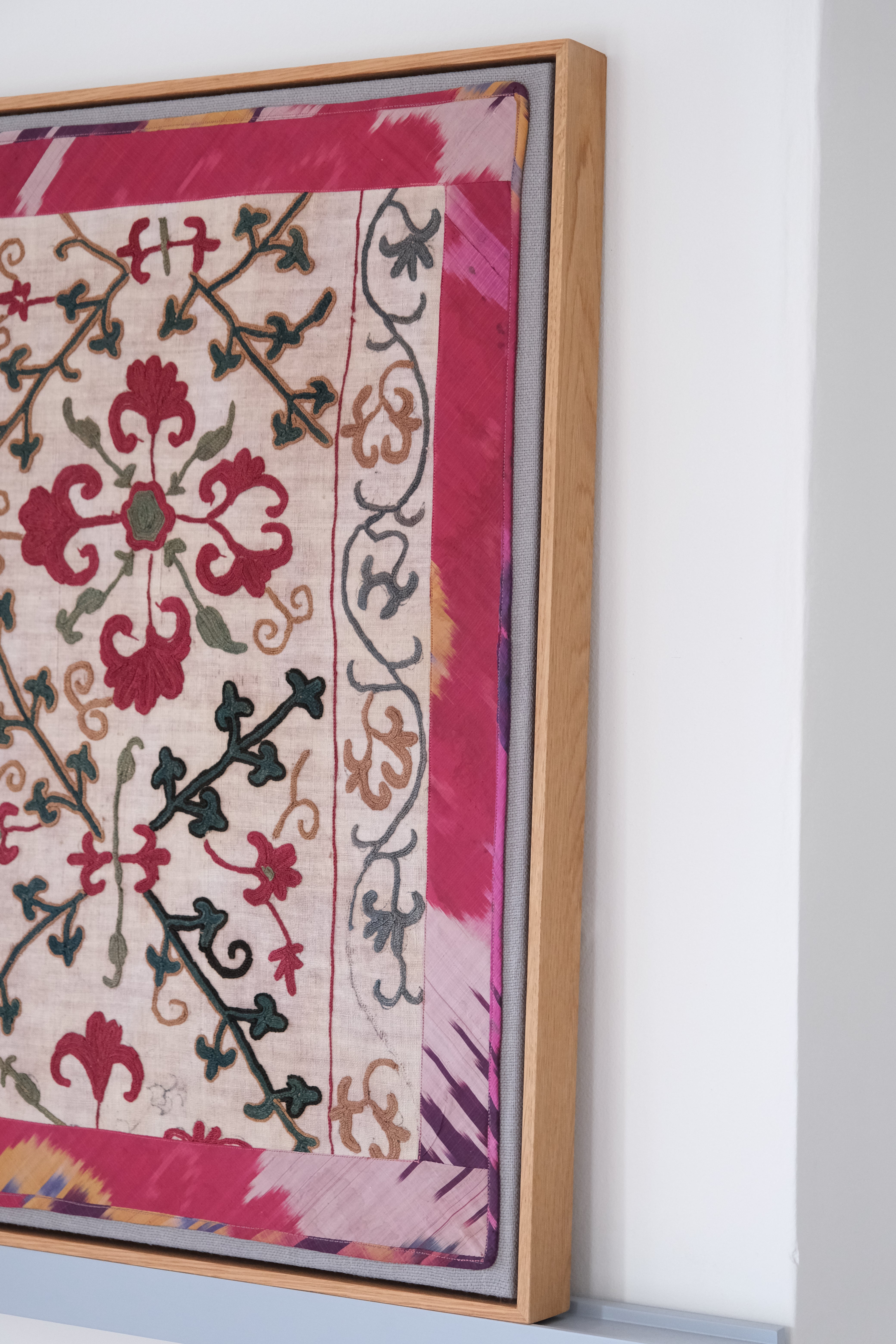 Framed antique suzani, dark pink & green