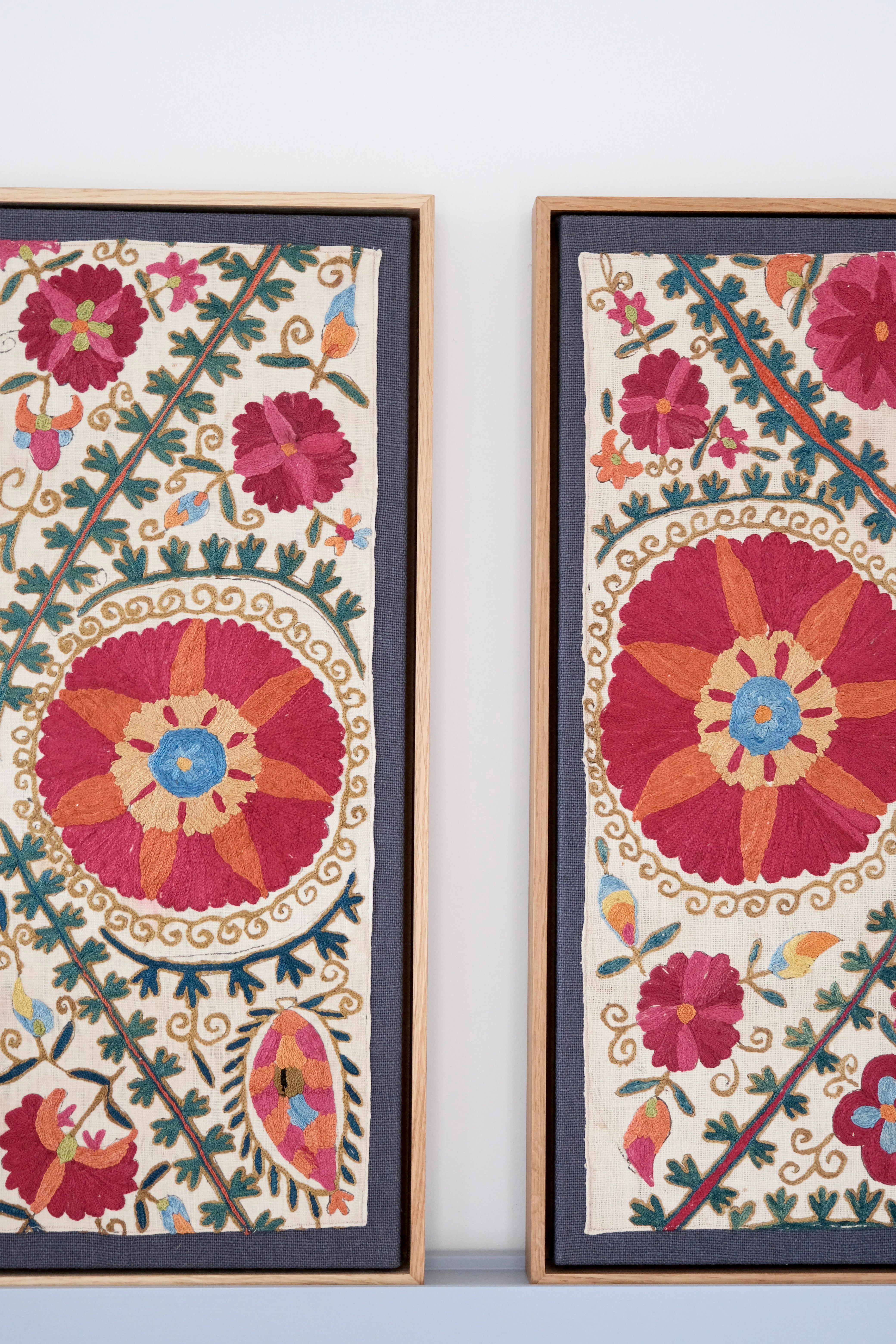 Pair of framed antique suzanis