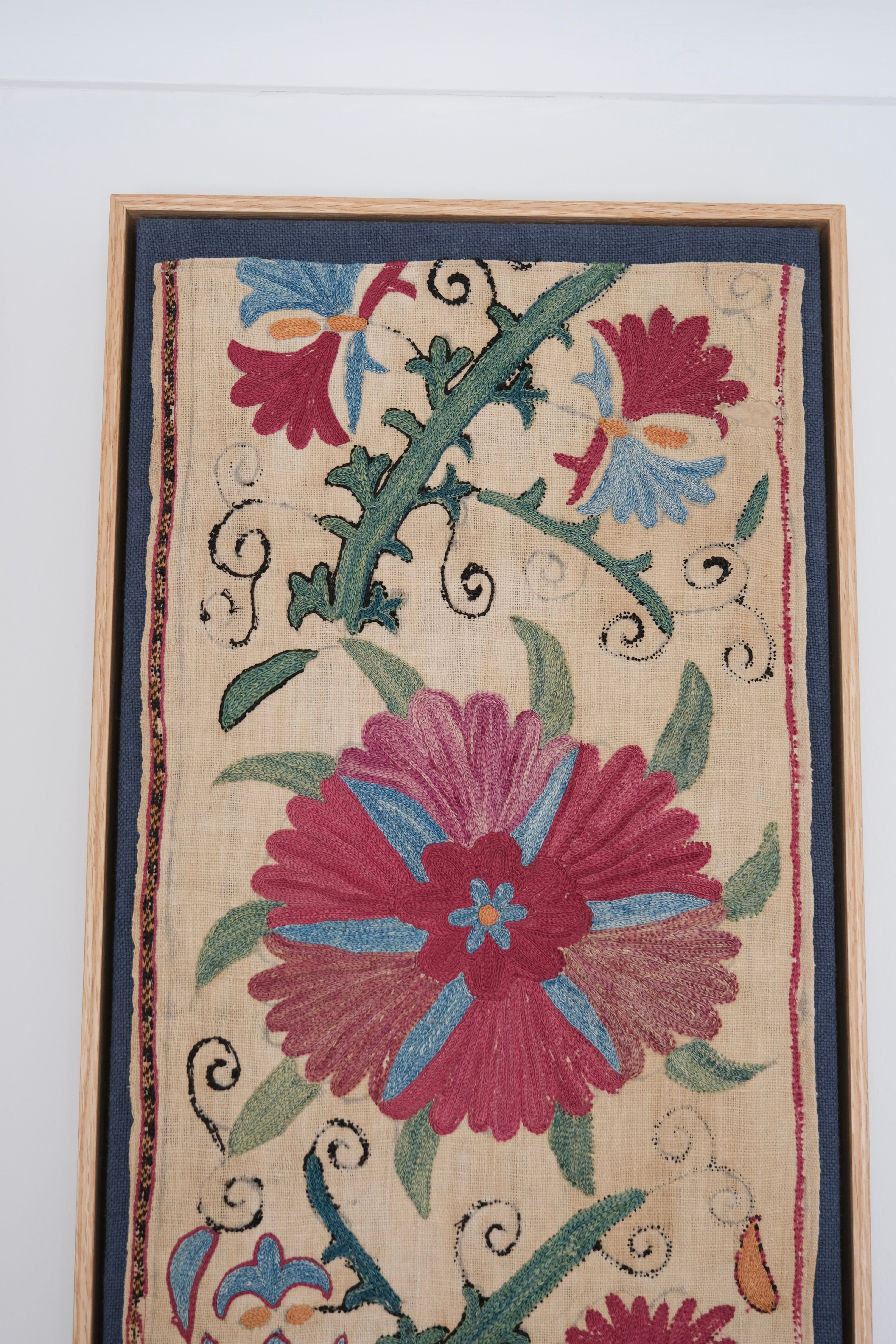 Pair of framed antique suzanis, pink & tan