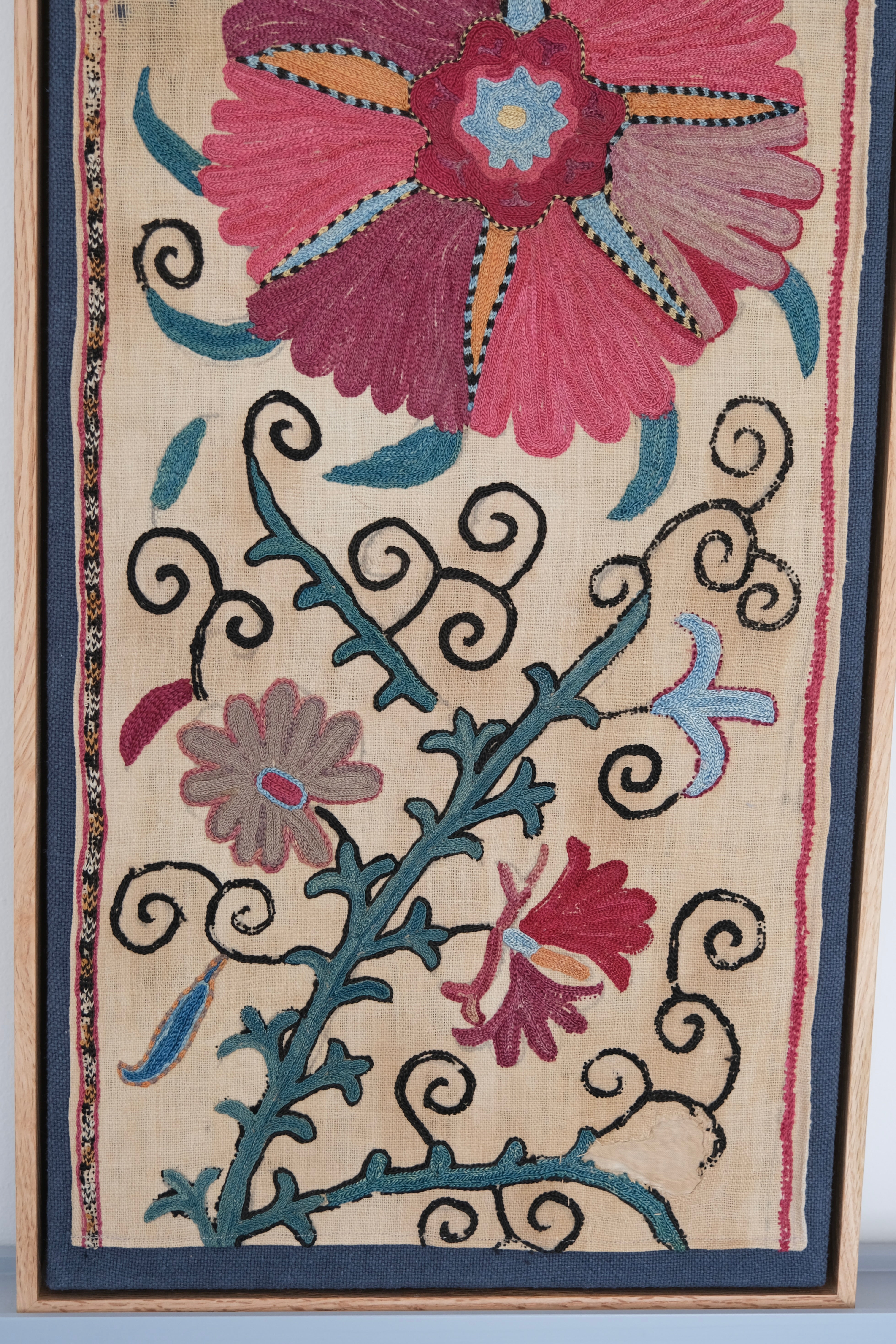 Pair of framed antique suzanis, pink & tan