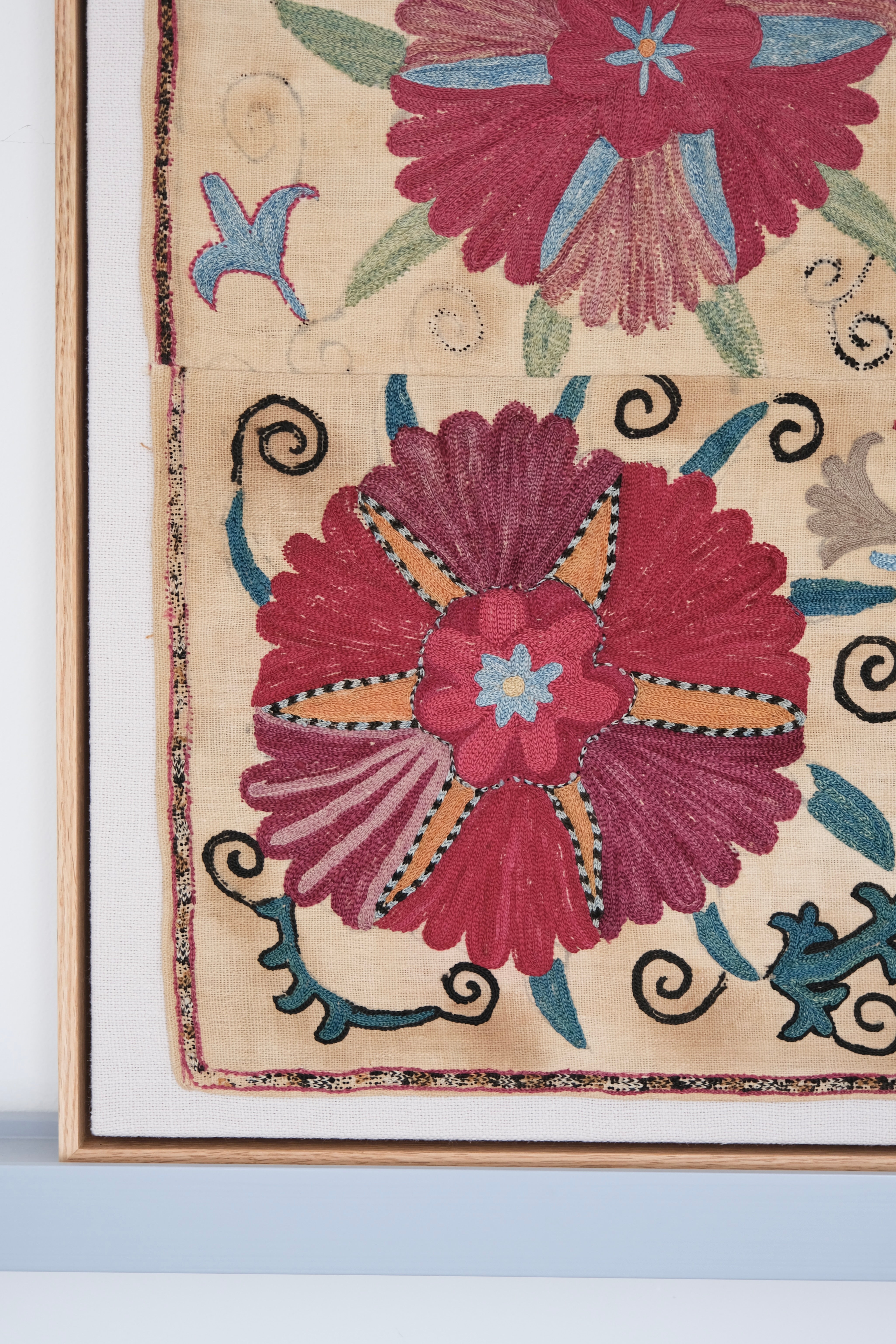 Framed antique suzani, pink & tan