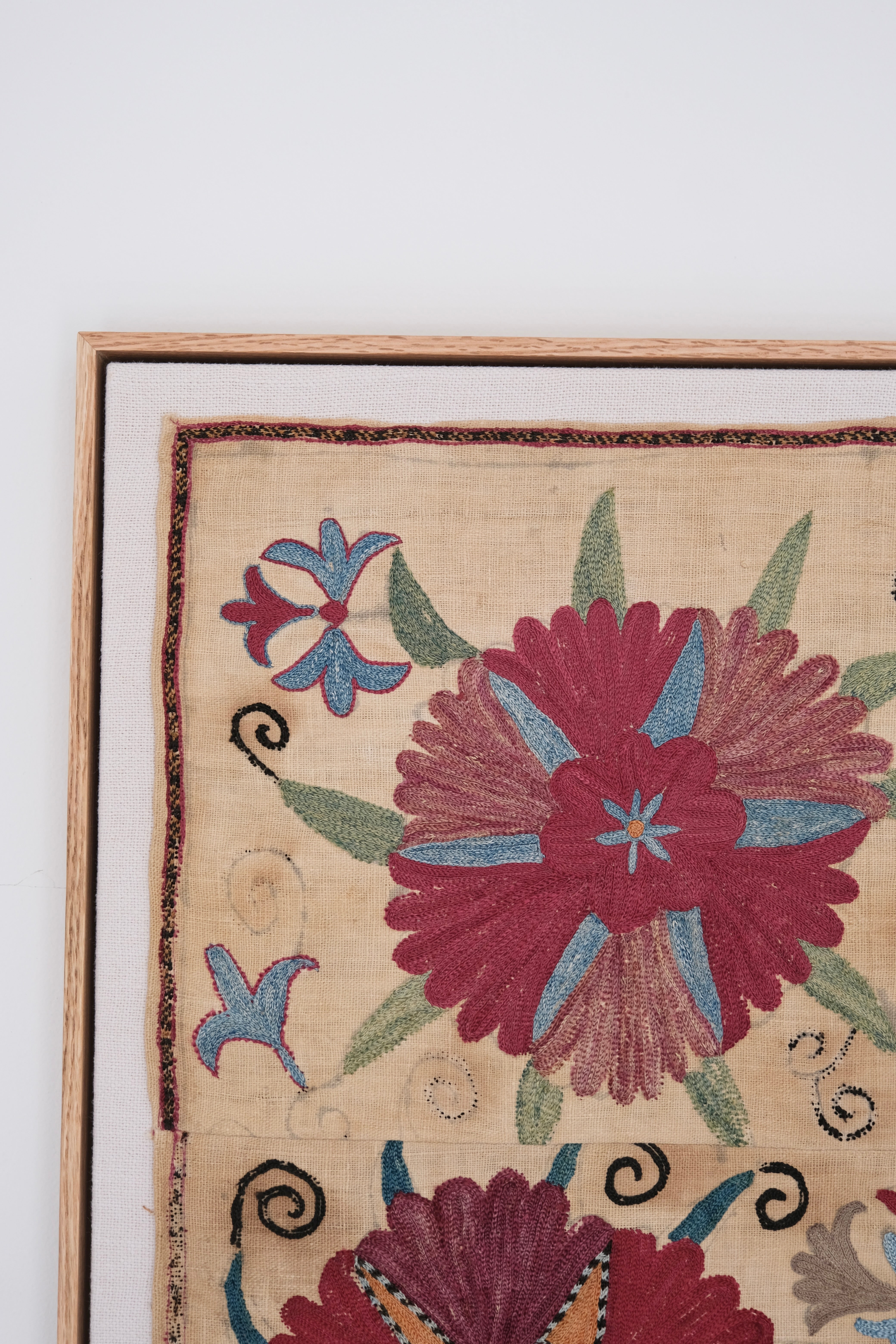 Framed antique suzani, pink & tan