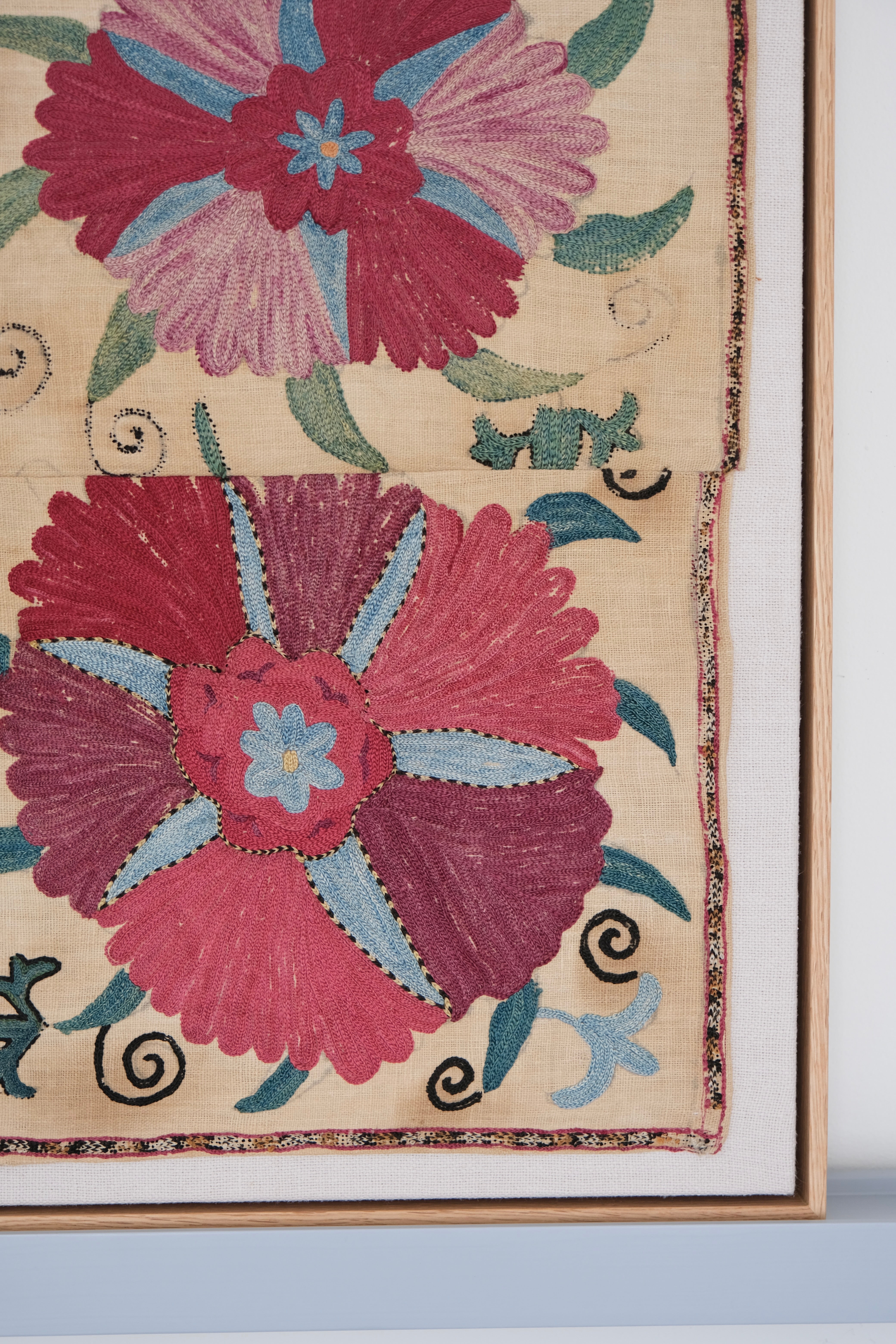 Framed antique suzani, pink & tan