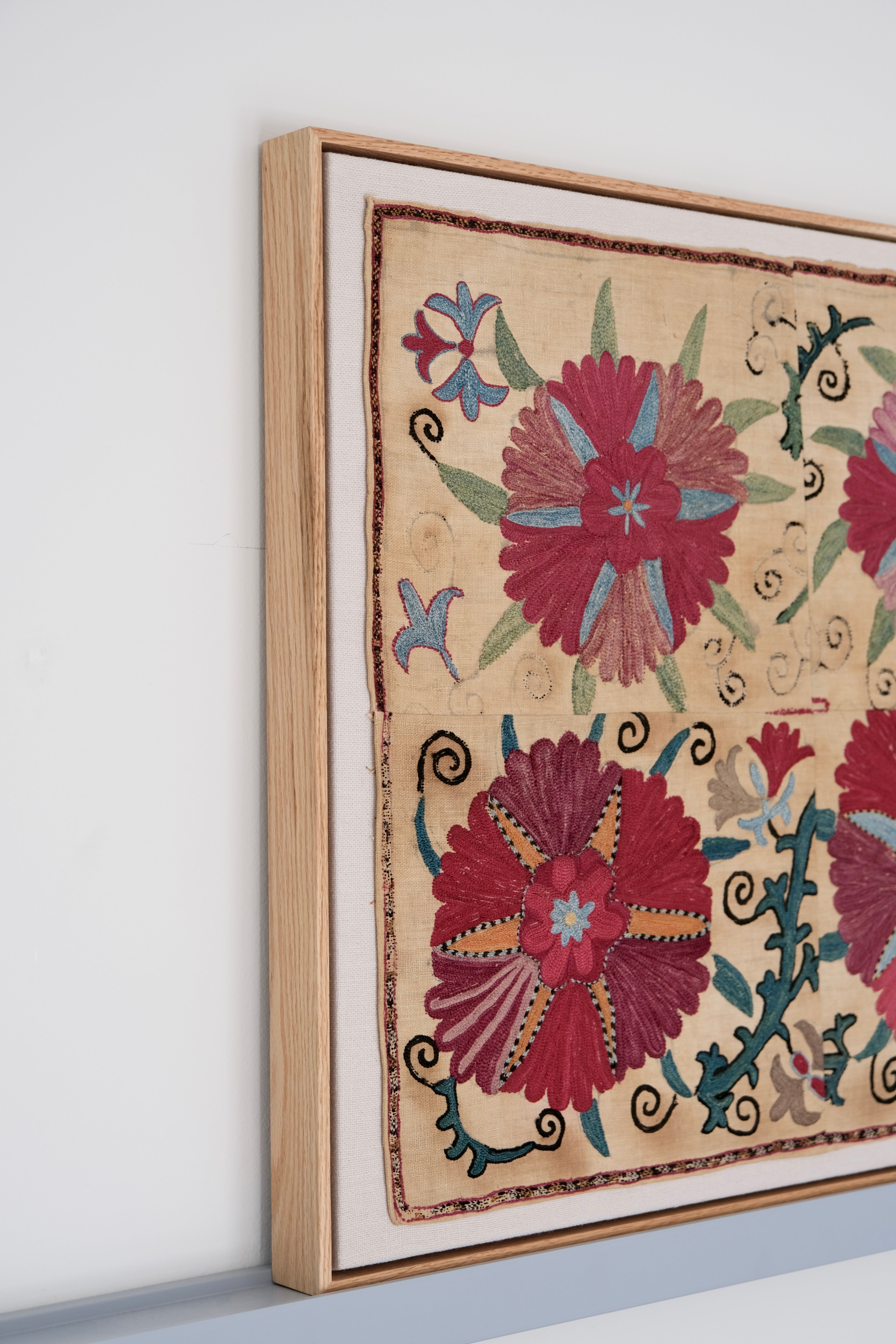 Framed antique suzani, pink & tan