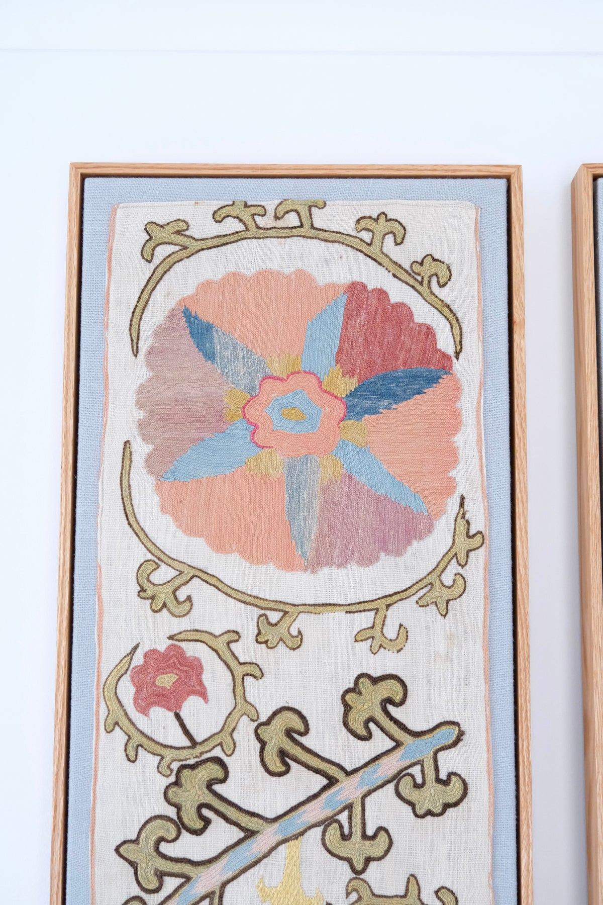Pair of framed antique suzanis, pastel colours