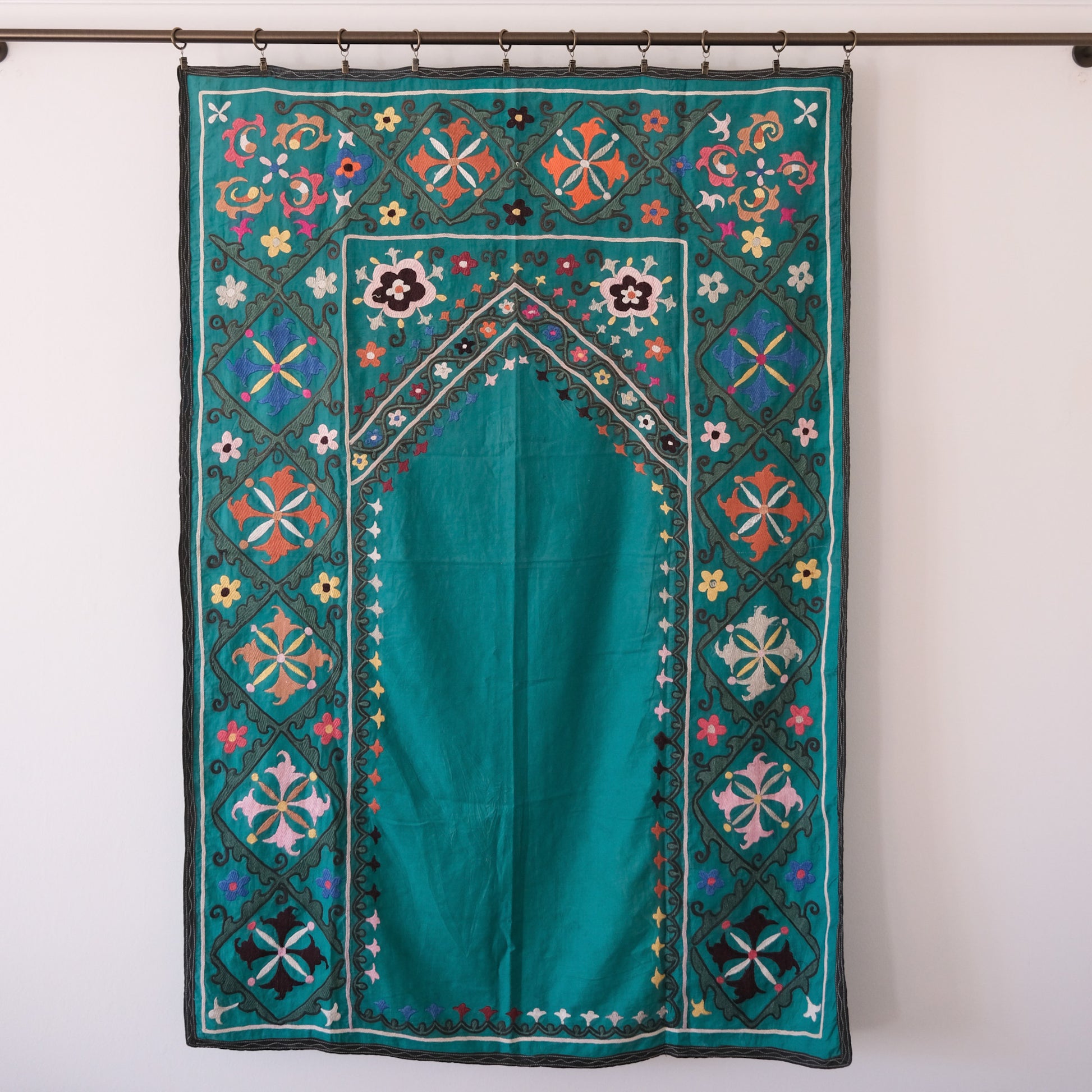 Vintage suzani, colourful embroidered textile, turquoise with flowers
