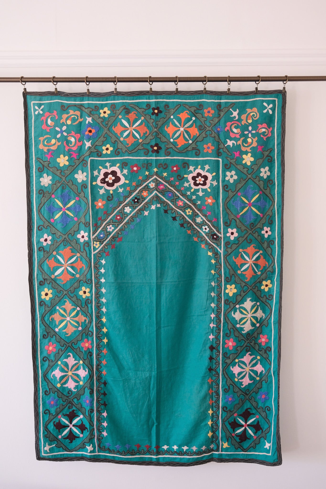 Vintage suzani, colourful embroidered textile, turquoise with flowers