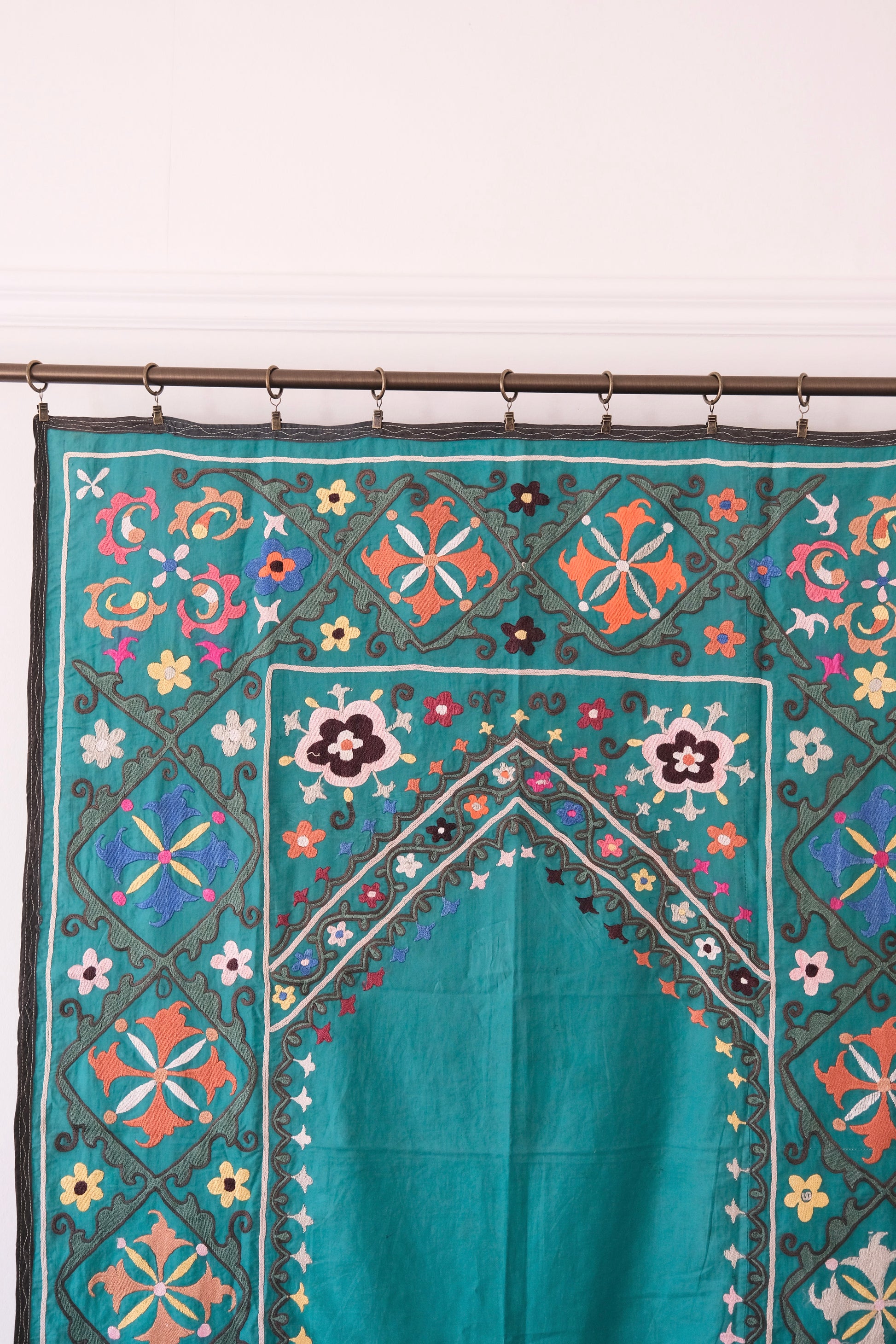 Vintage suzani, colourful embroidered textile, turquoise with flowers