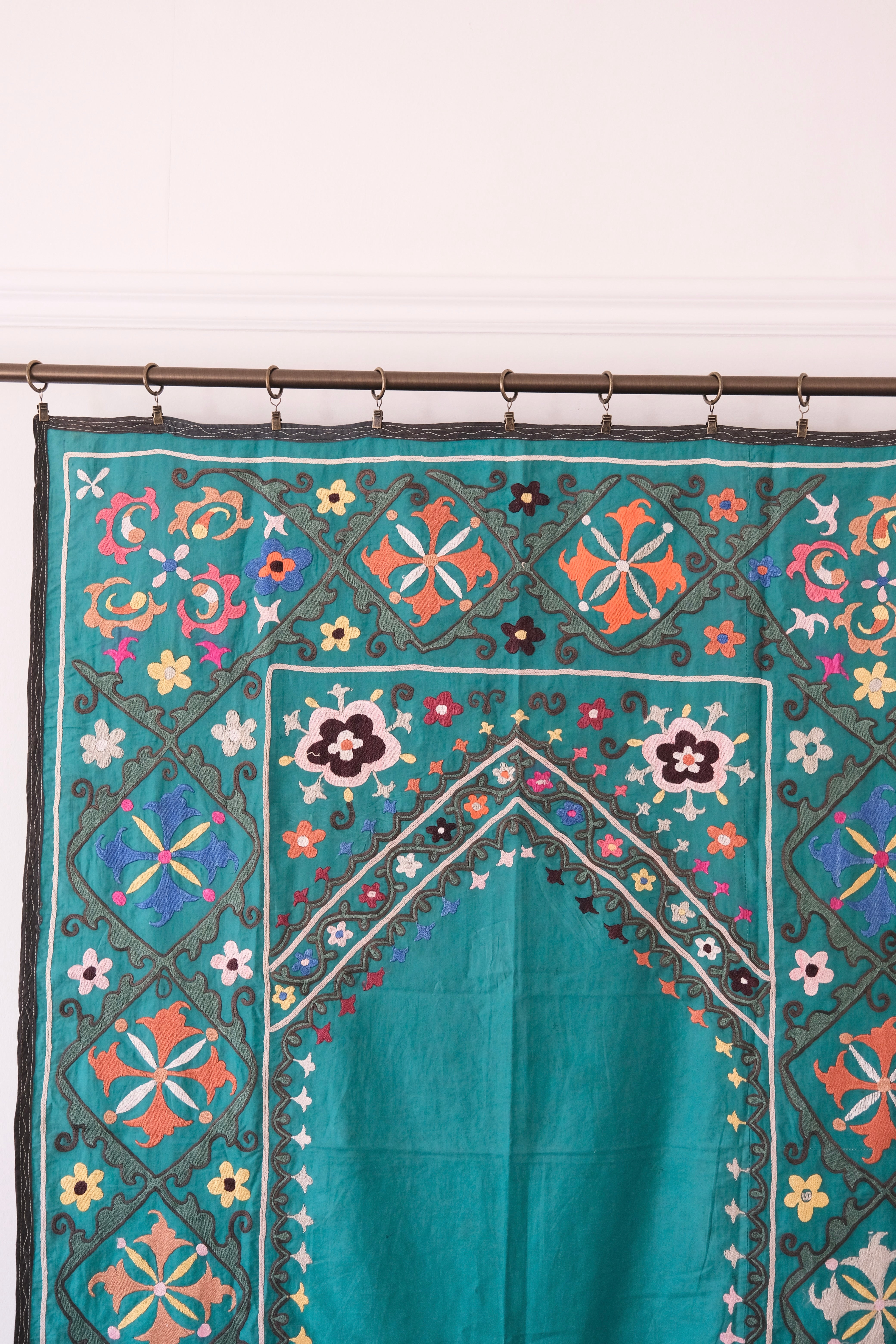 Vintage suzani, colourful embroidered textile, turquoise with flowers