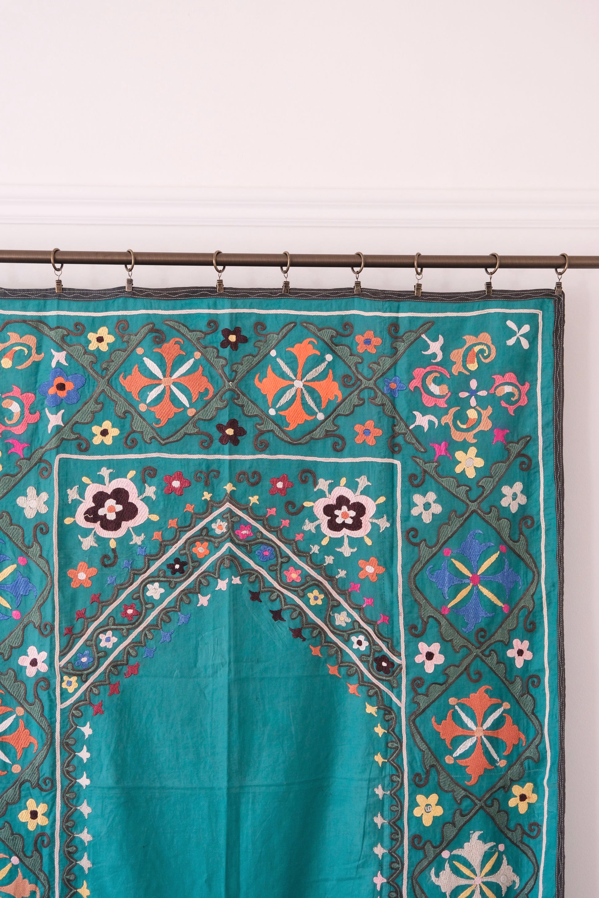 Vintage suzani, colourful embroidered textile, turquoise with flowers