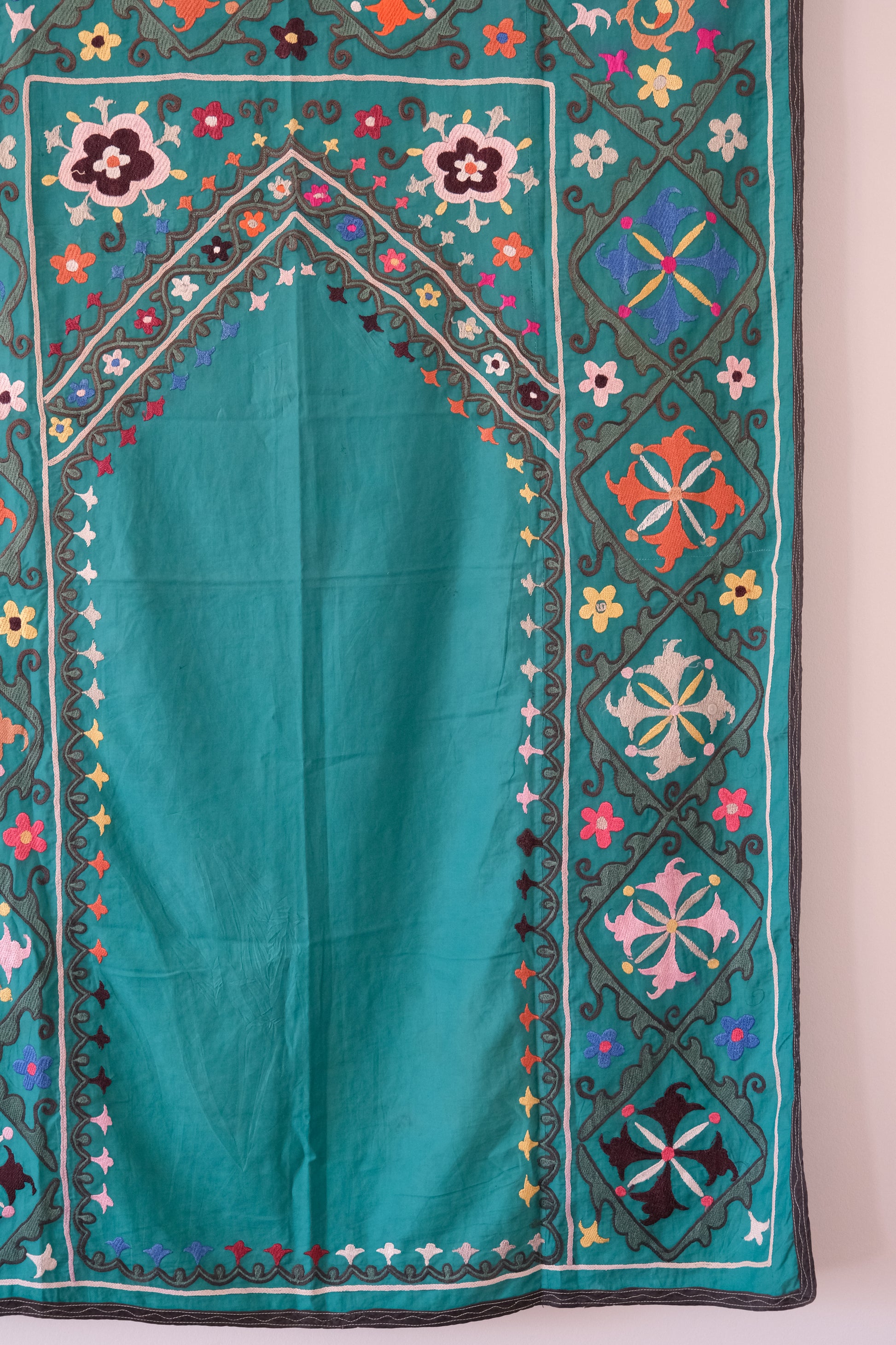 Vintage suzani, colourful embroidered textile, turquoise with flowers