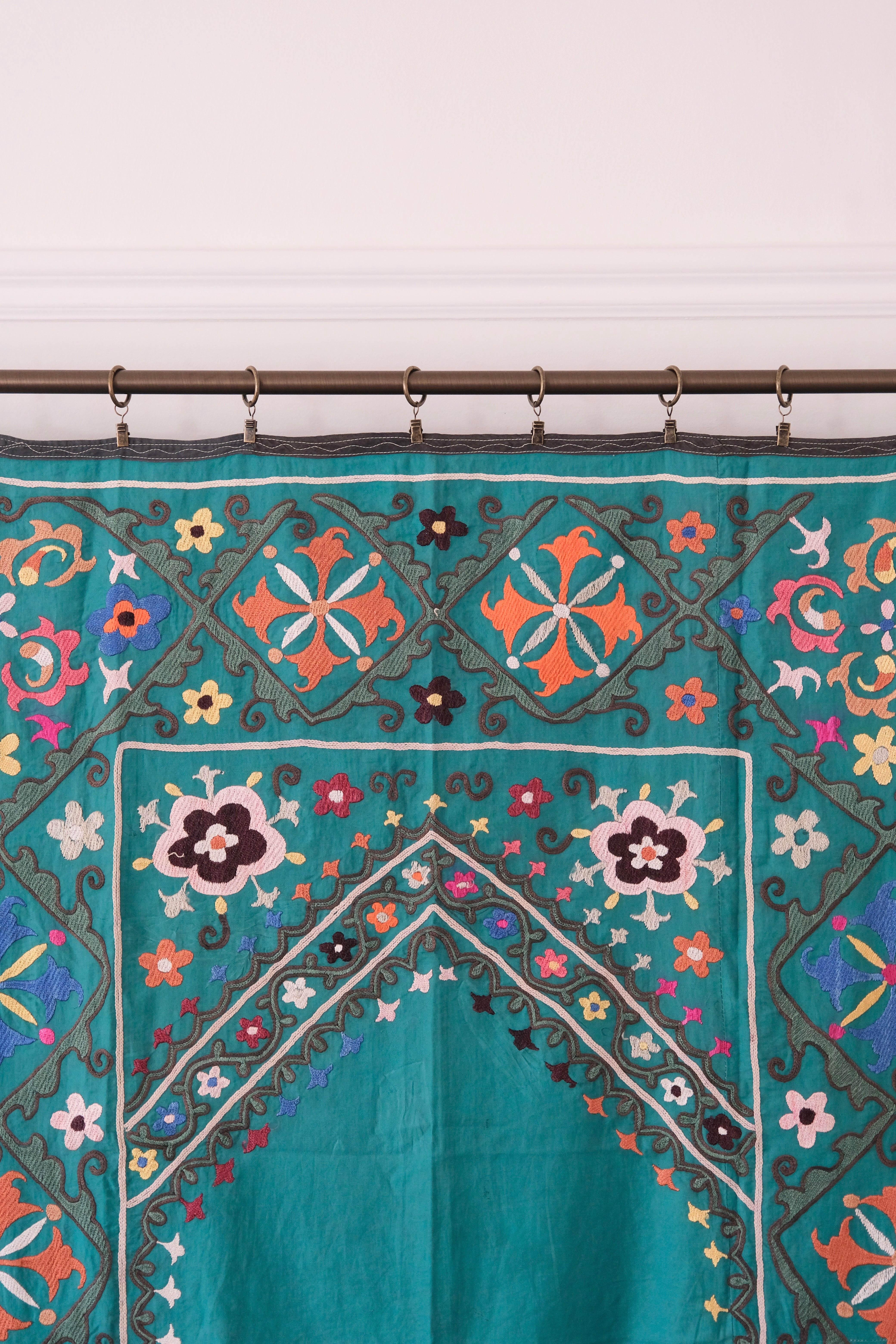Vintage suzani, colourful embroidered textile, turquoise with flowers
