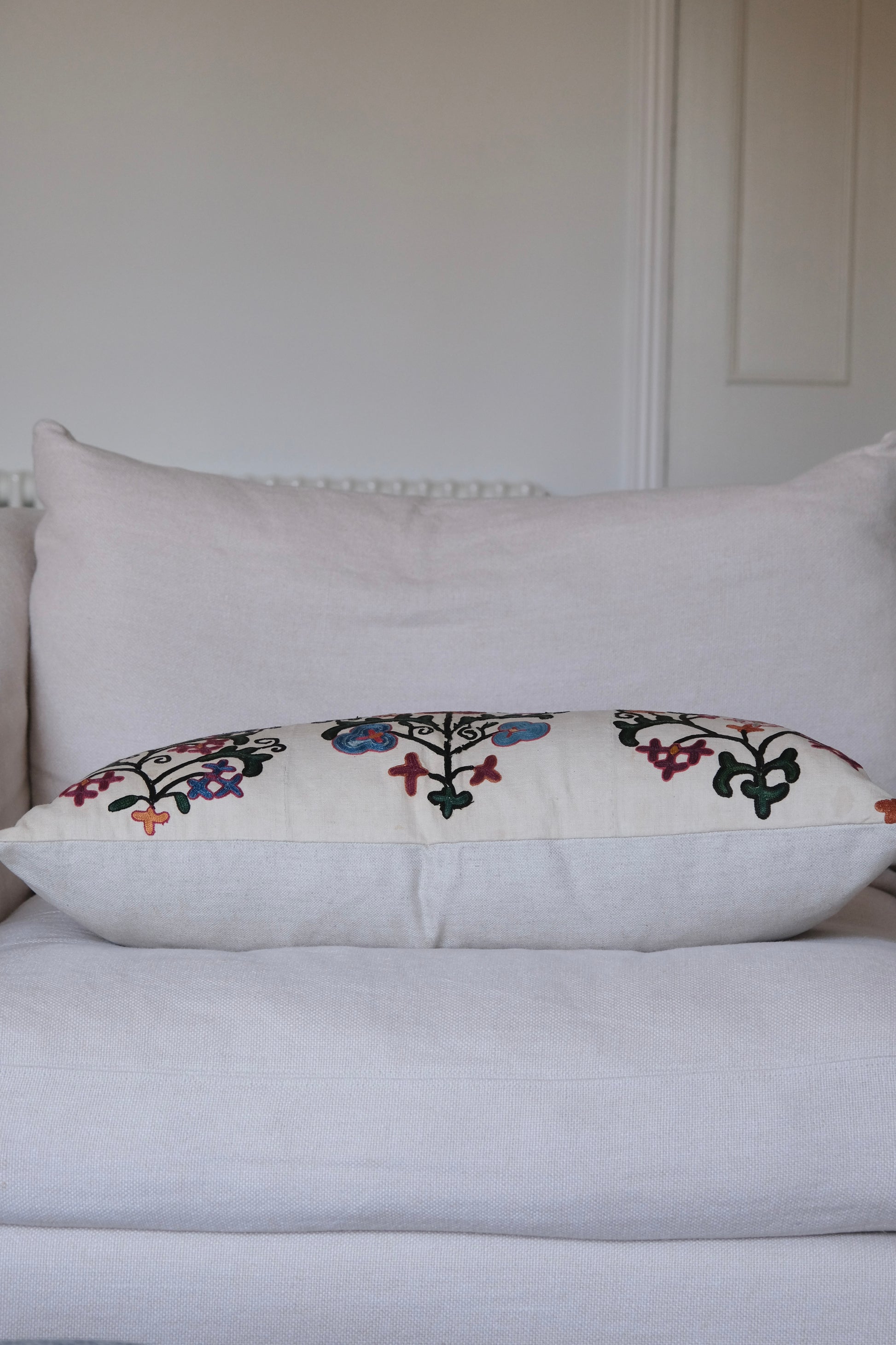 Antique suzani lumbar cushion, floral design, side view