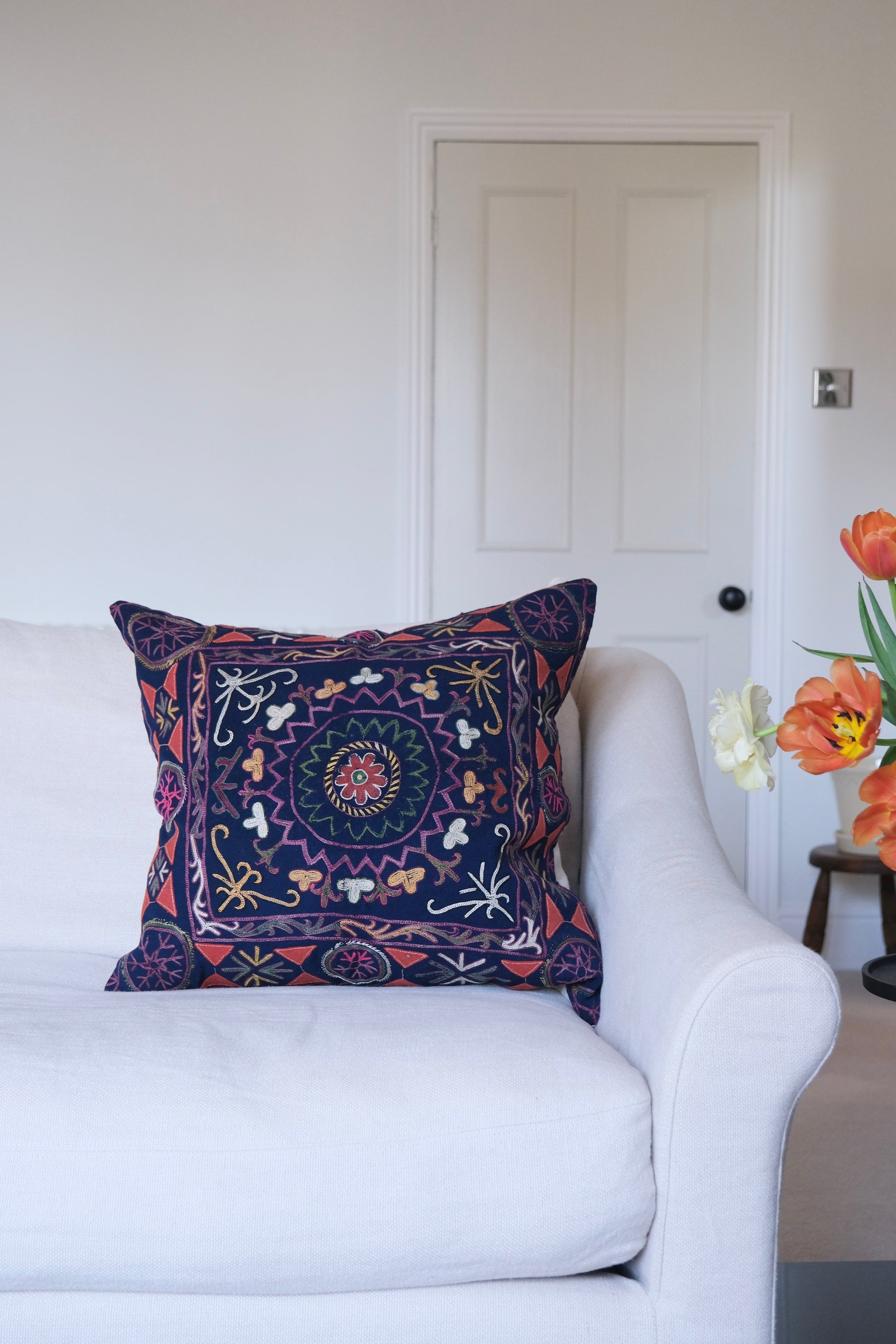 Vintage suzani cushion, blue with colourful pattern