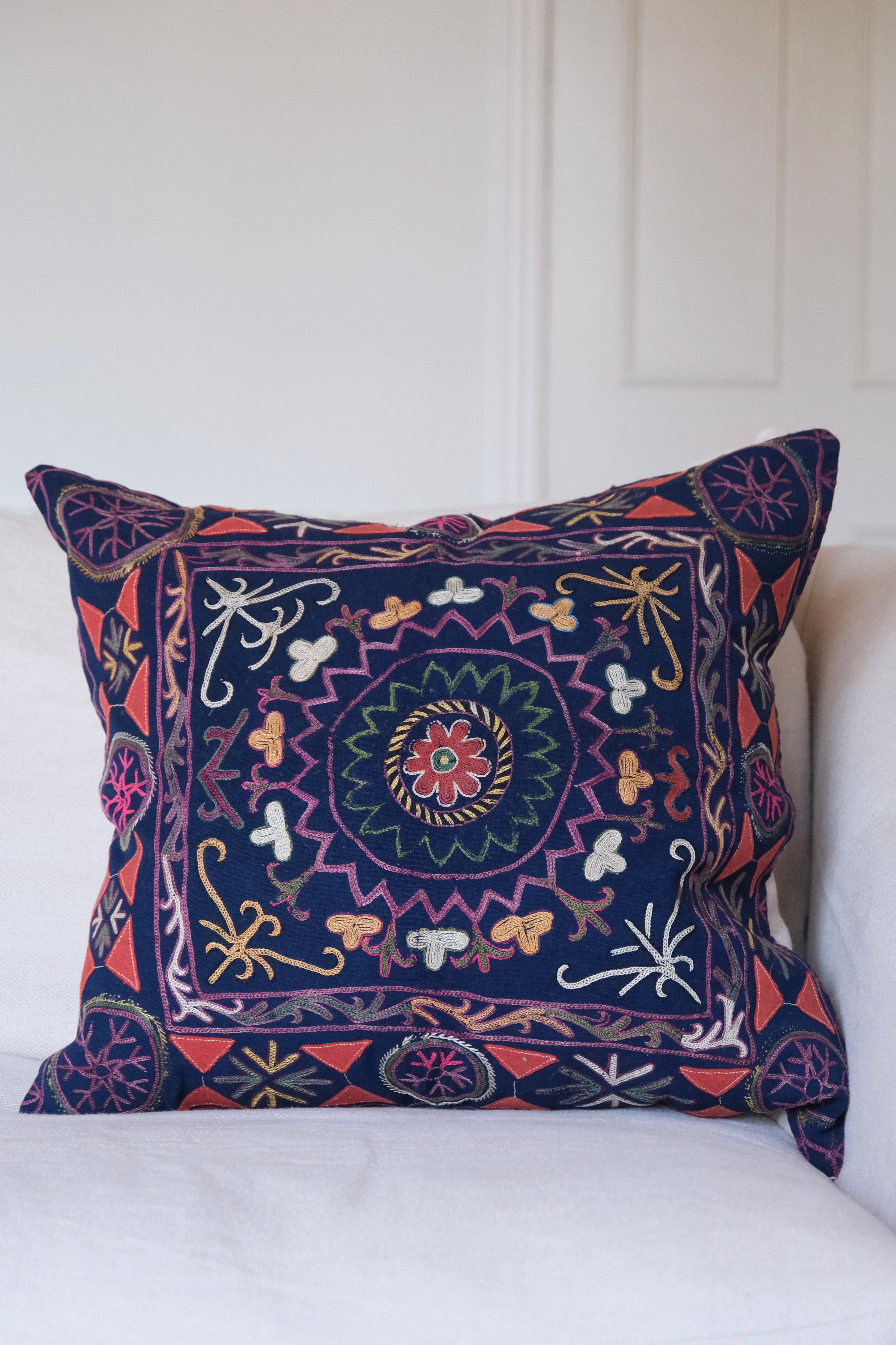 Vintage suzani cushion, blue with colourful pattern