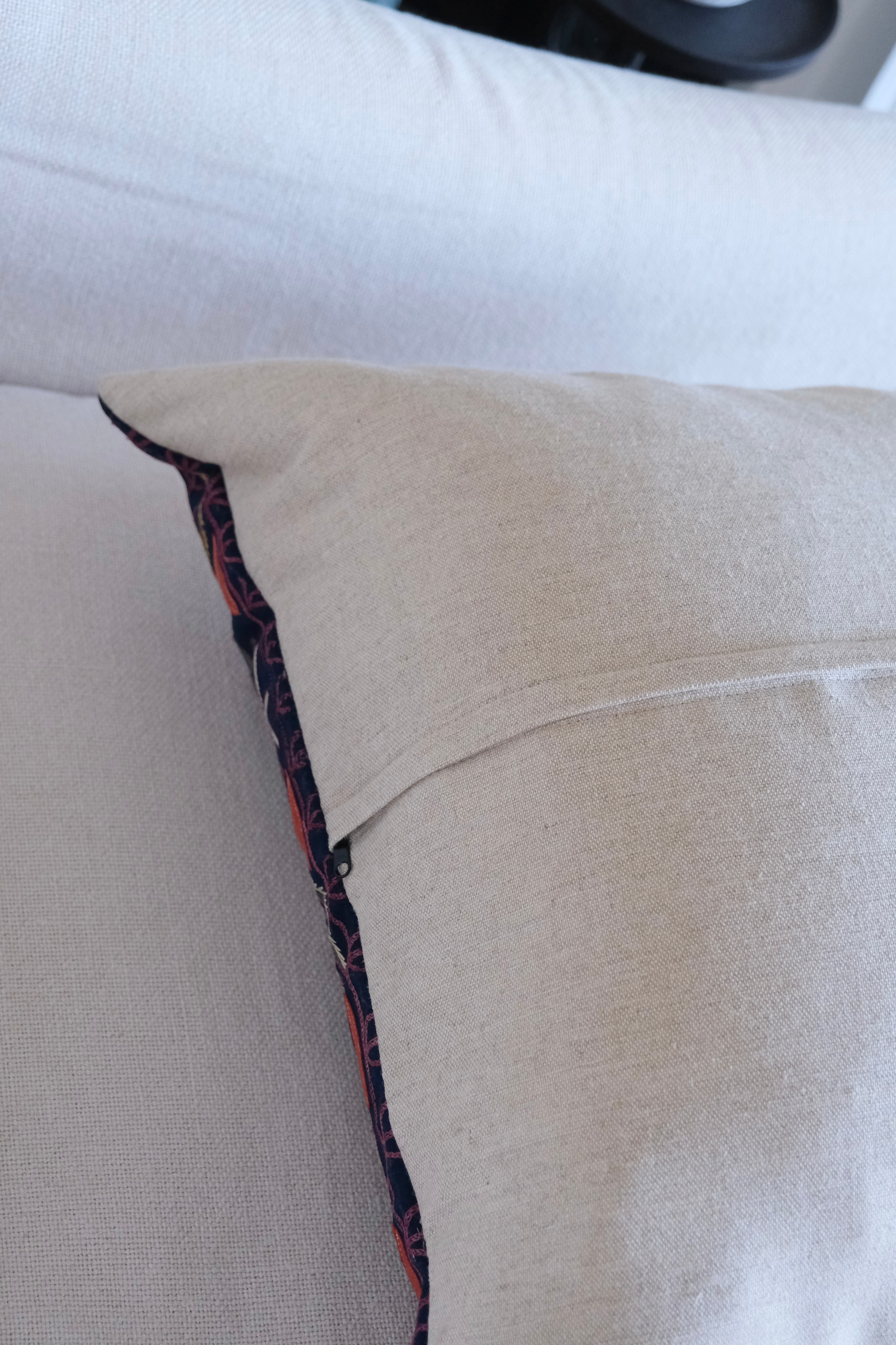 Vintage suzani cushion, blue with colourful pattern, linen back