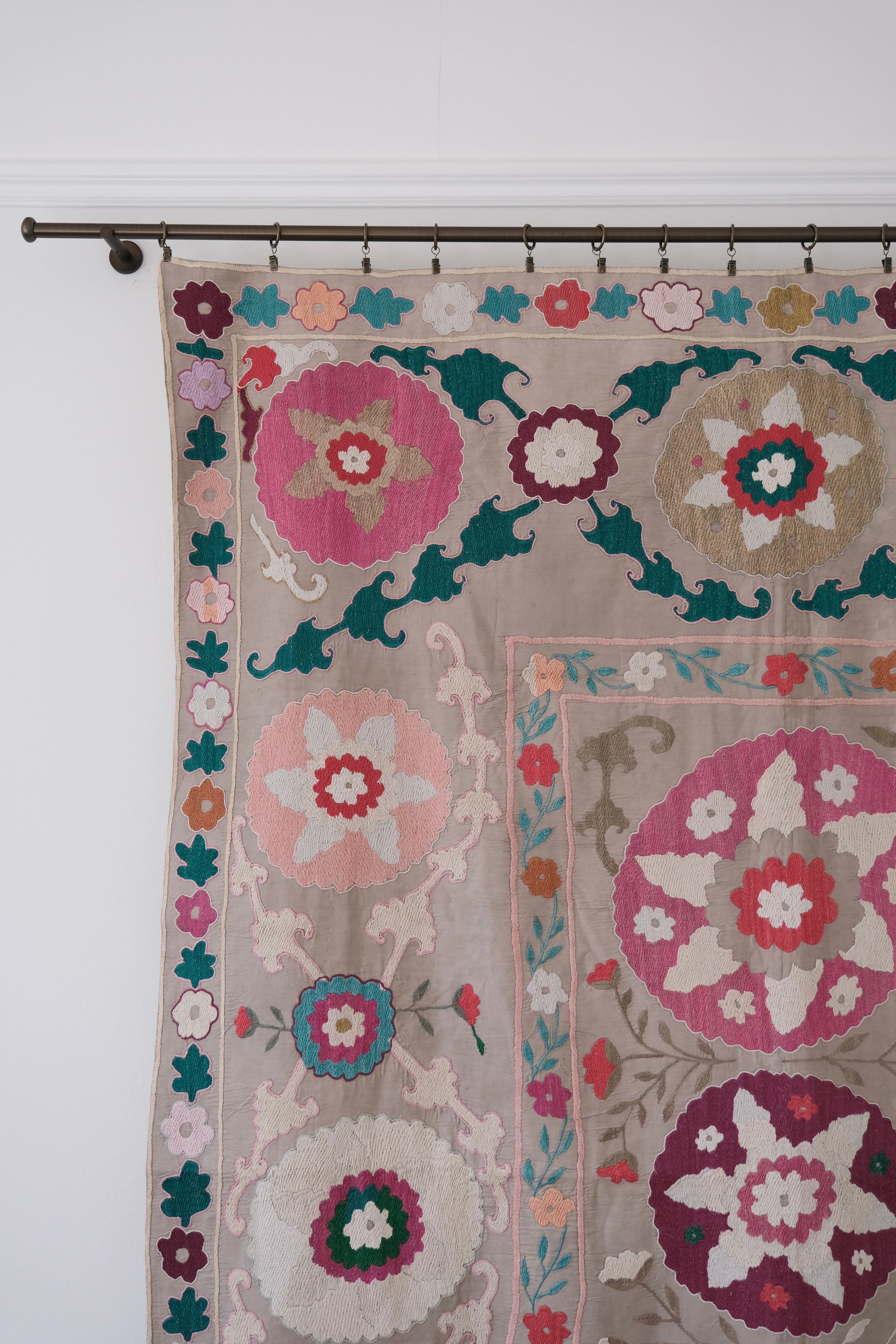 Vintage suzani, colourful bedspread, embroidered textile, close-up