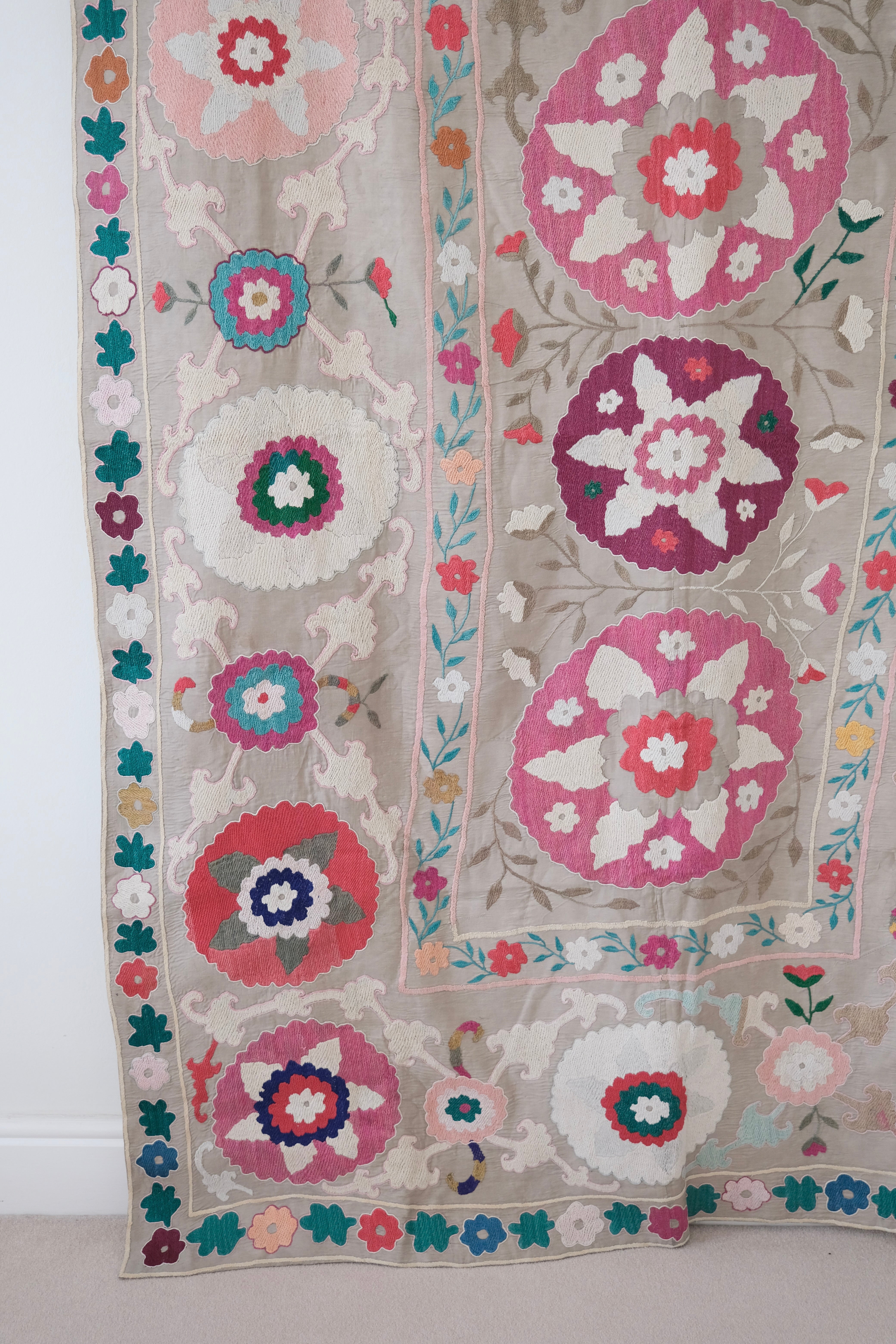 Vintage suzani, colourful bedspread, embroidered textile, close-up