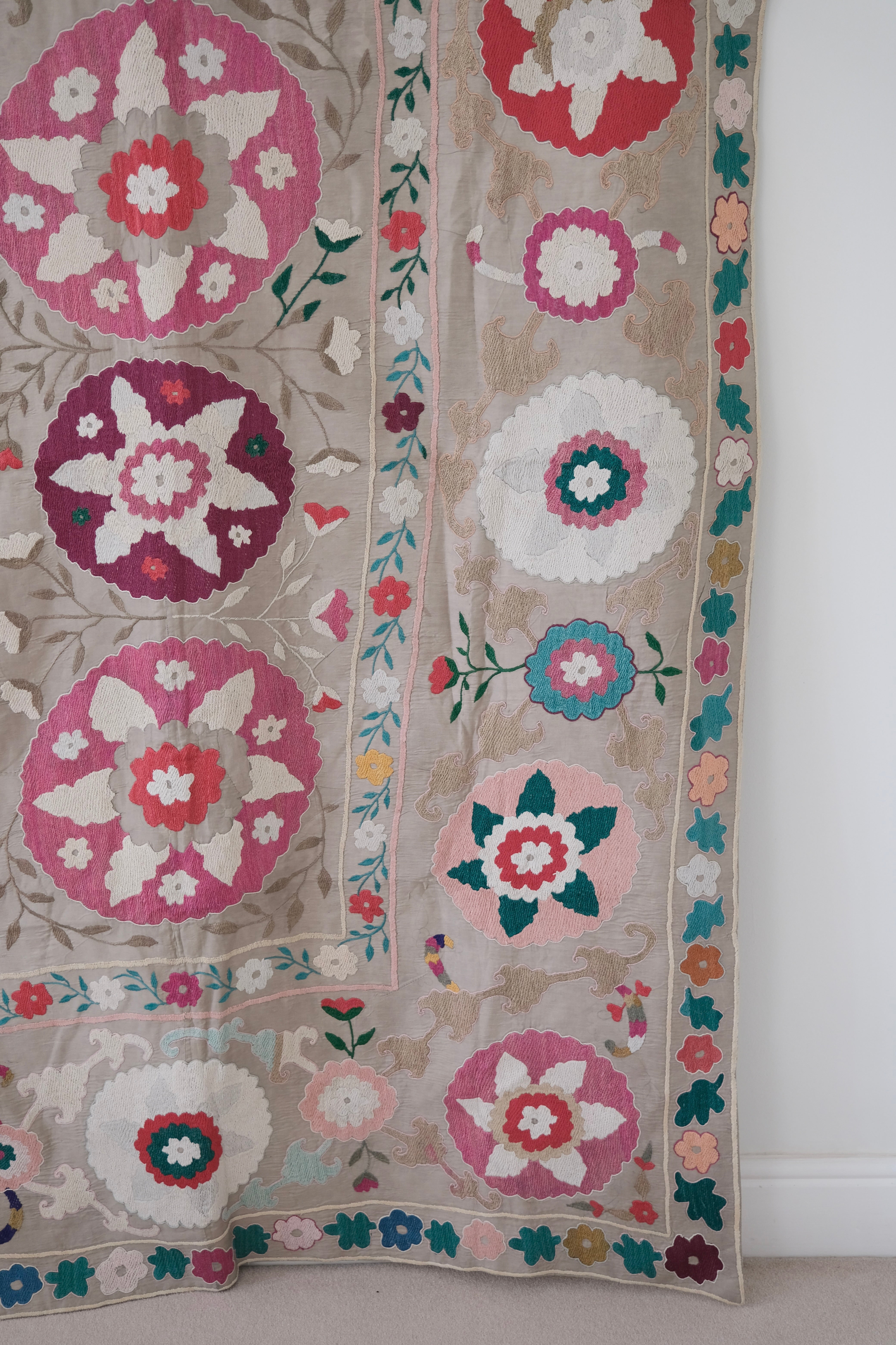Vintage suzani, colourful bedspread, embroidered textile, close-up
