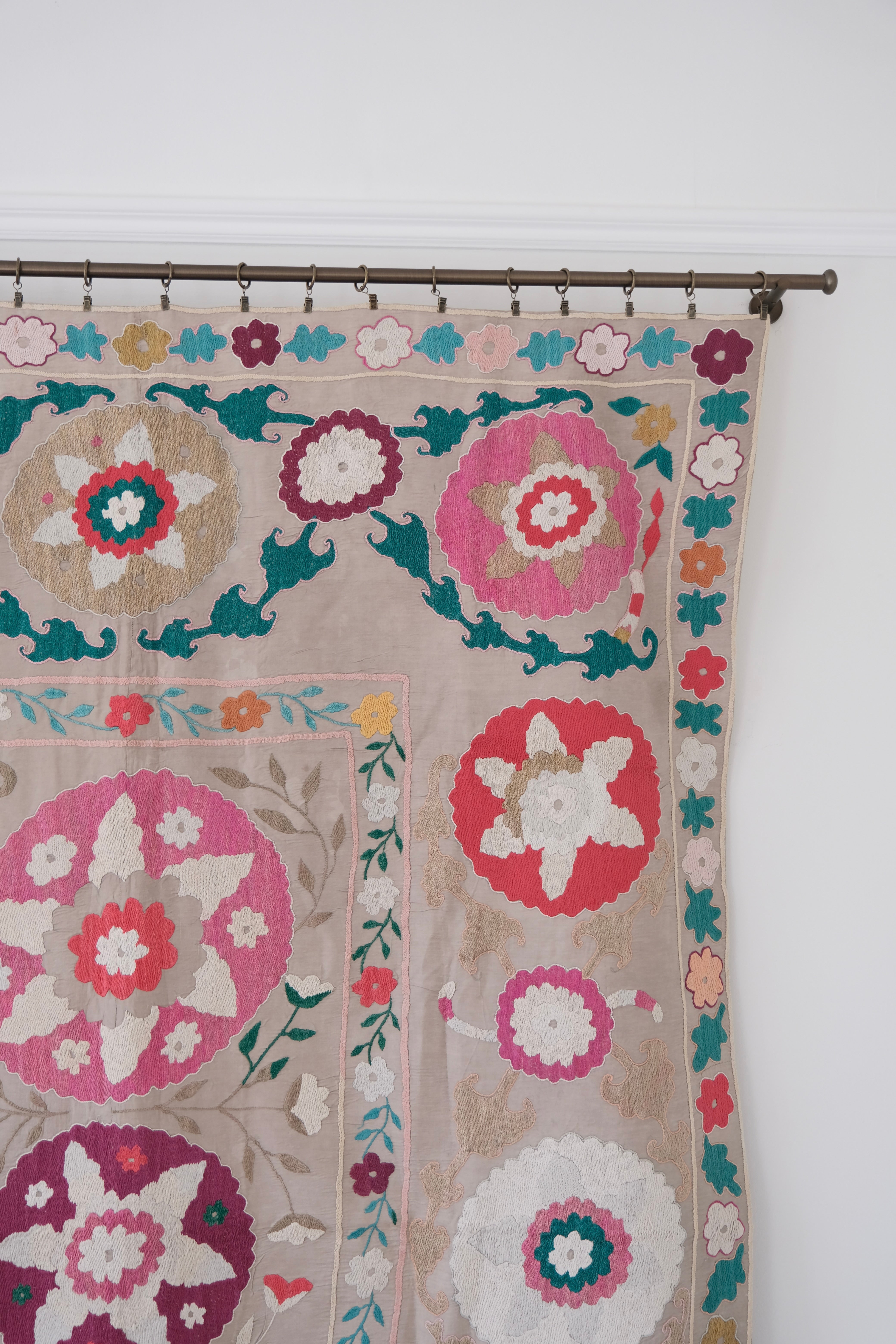 Vintage suzani, colourful bedspread, embroidered textile, close-up