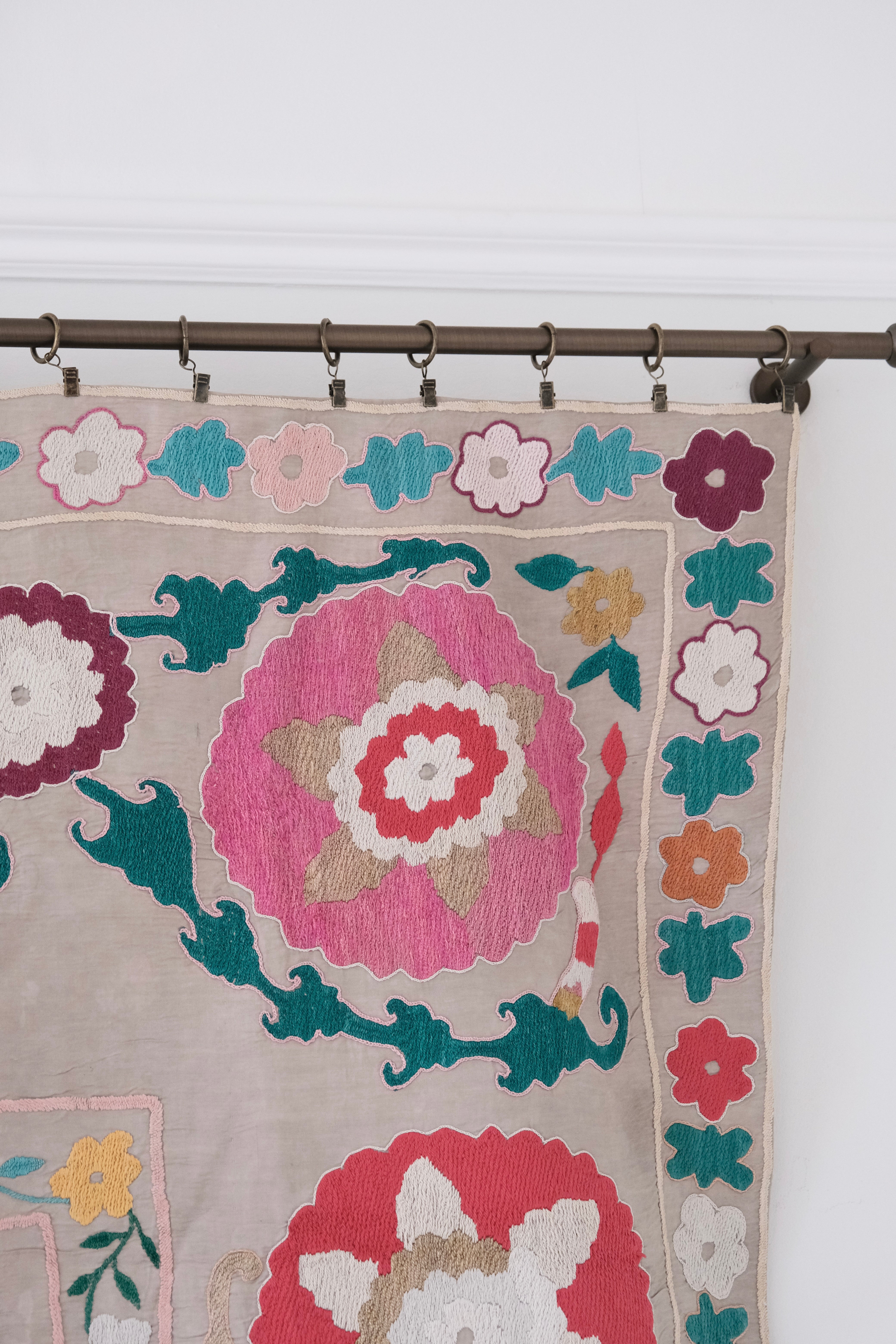 Vintage suzani, colourful bedspread, embroidered textile, close-up