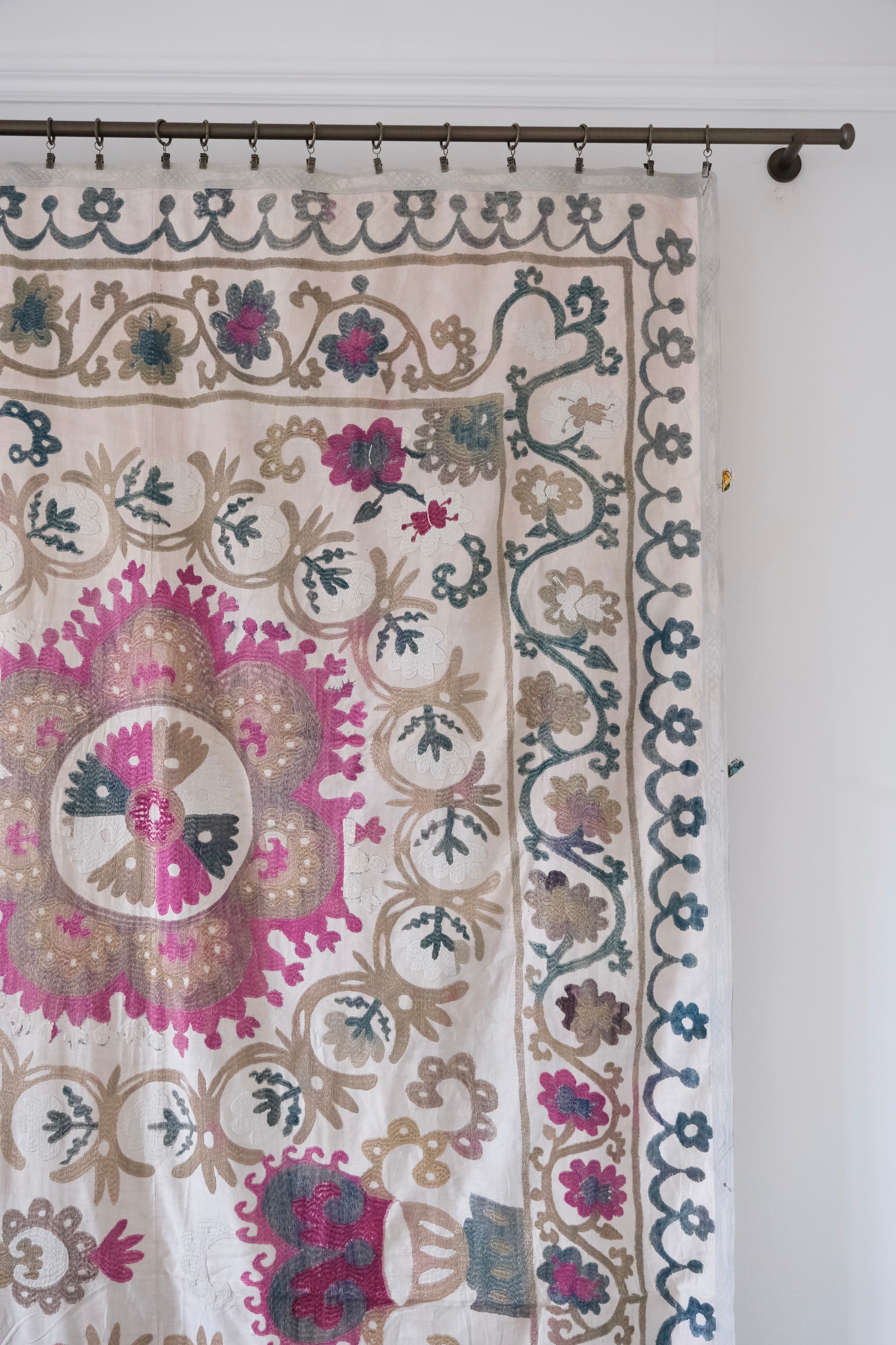 Vintage suzani, embroidered textile and decorative tapestry