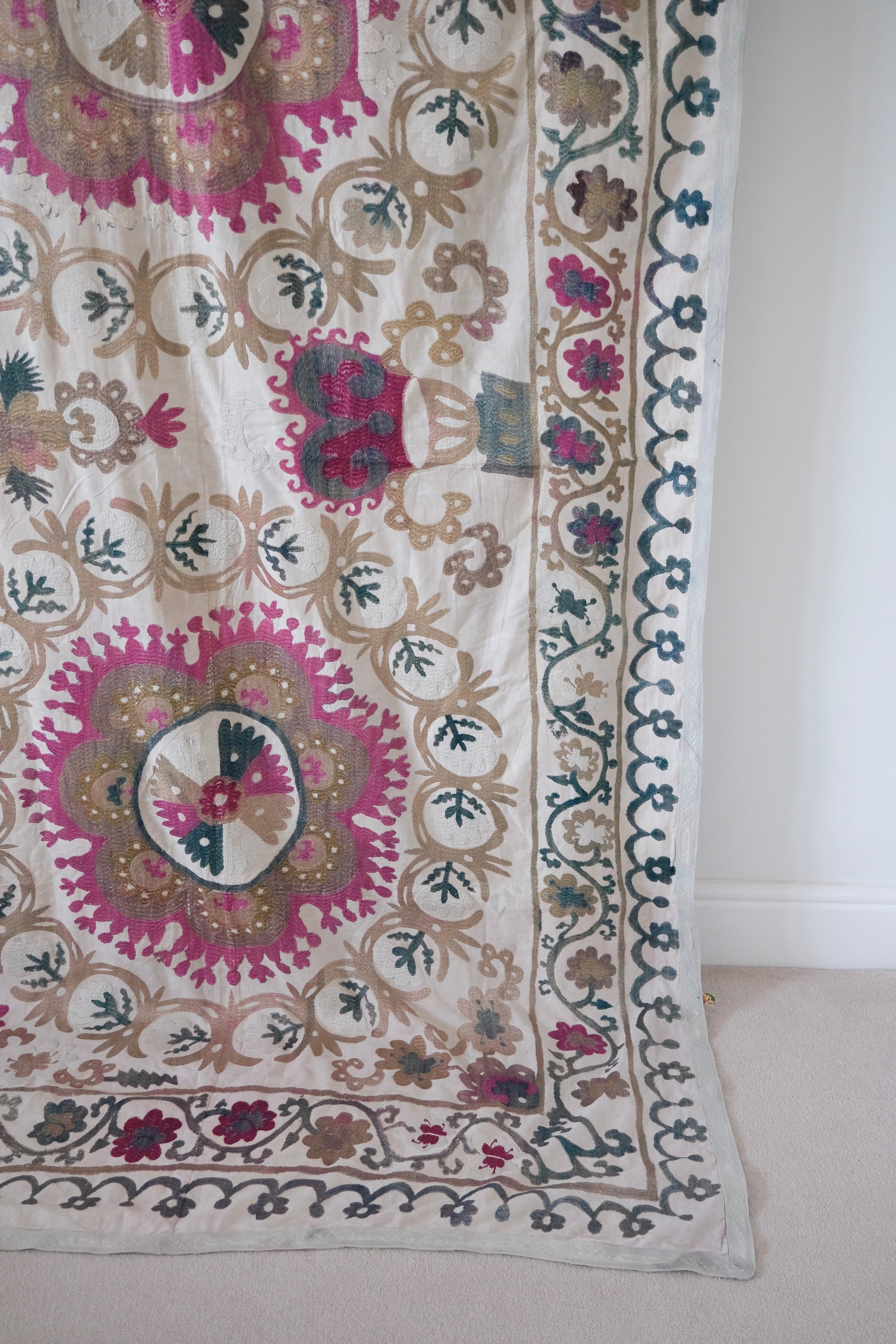 Vintage suzani, embroidered textile and decorative tapestry