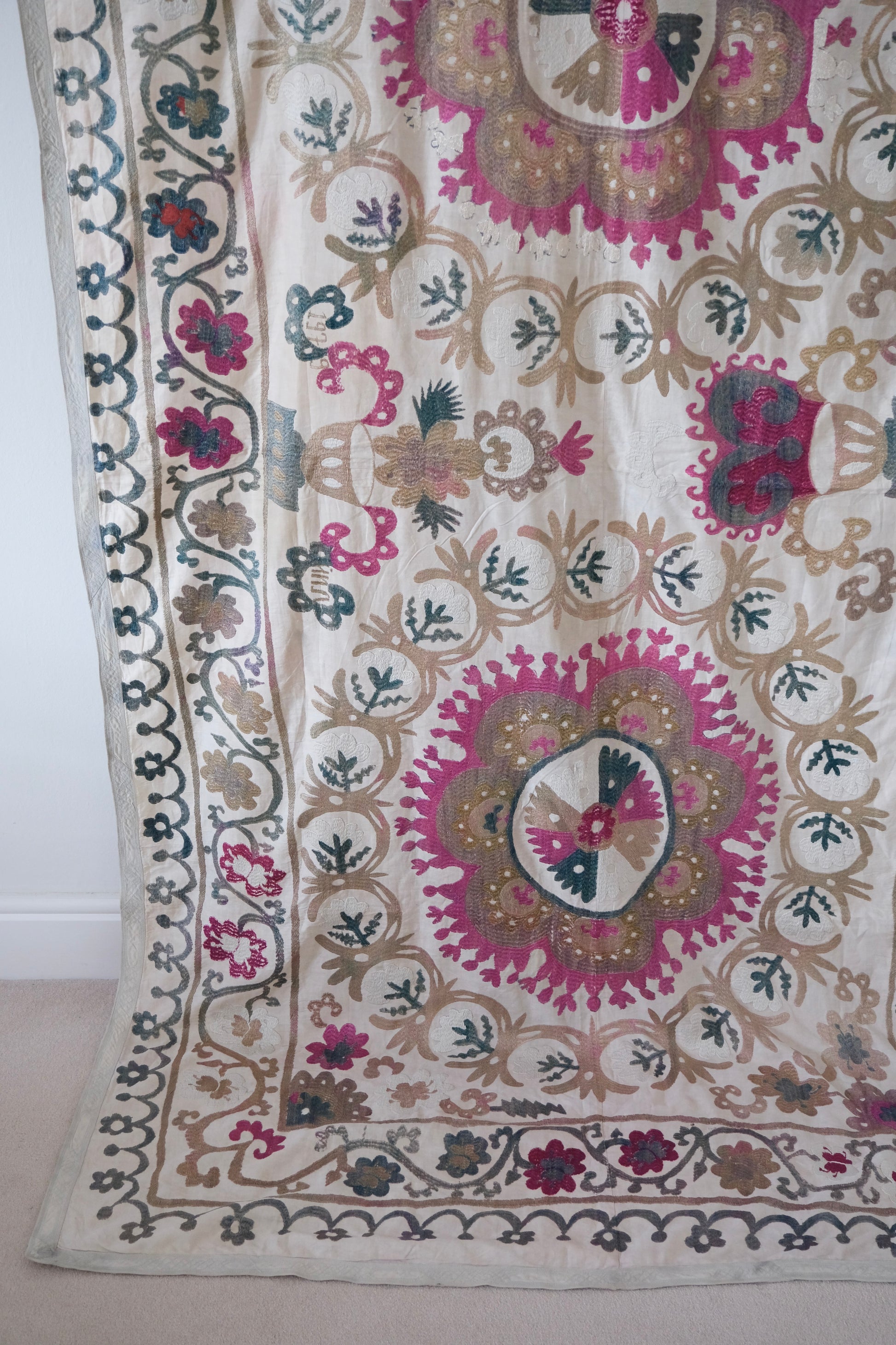 Vintage suzani, embroidered textile and decorative tapestry