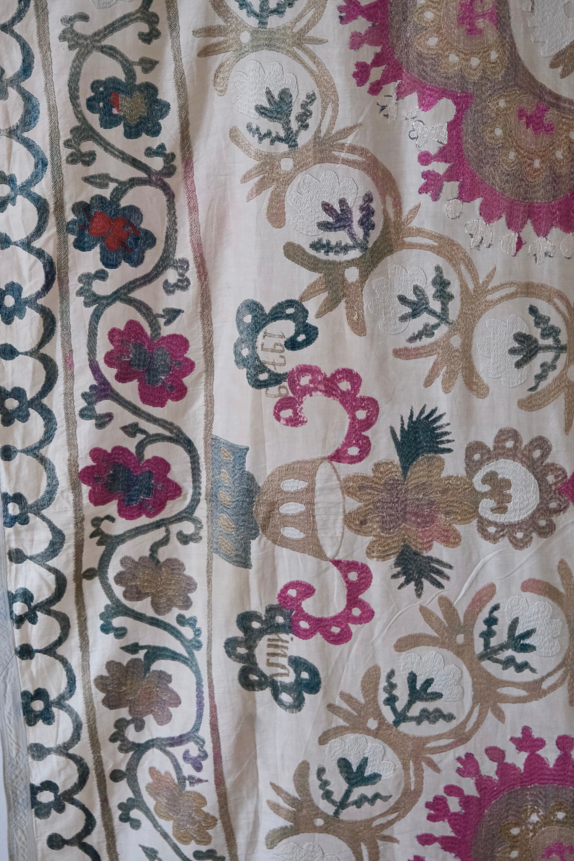Vintage suzani, embroidered textile and decorative tapestry, close-up