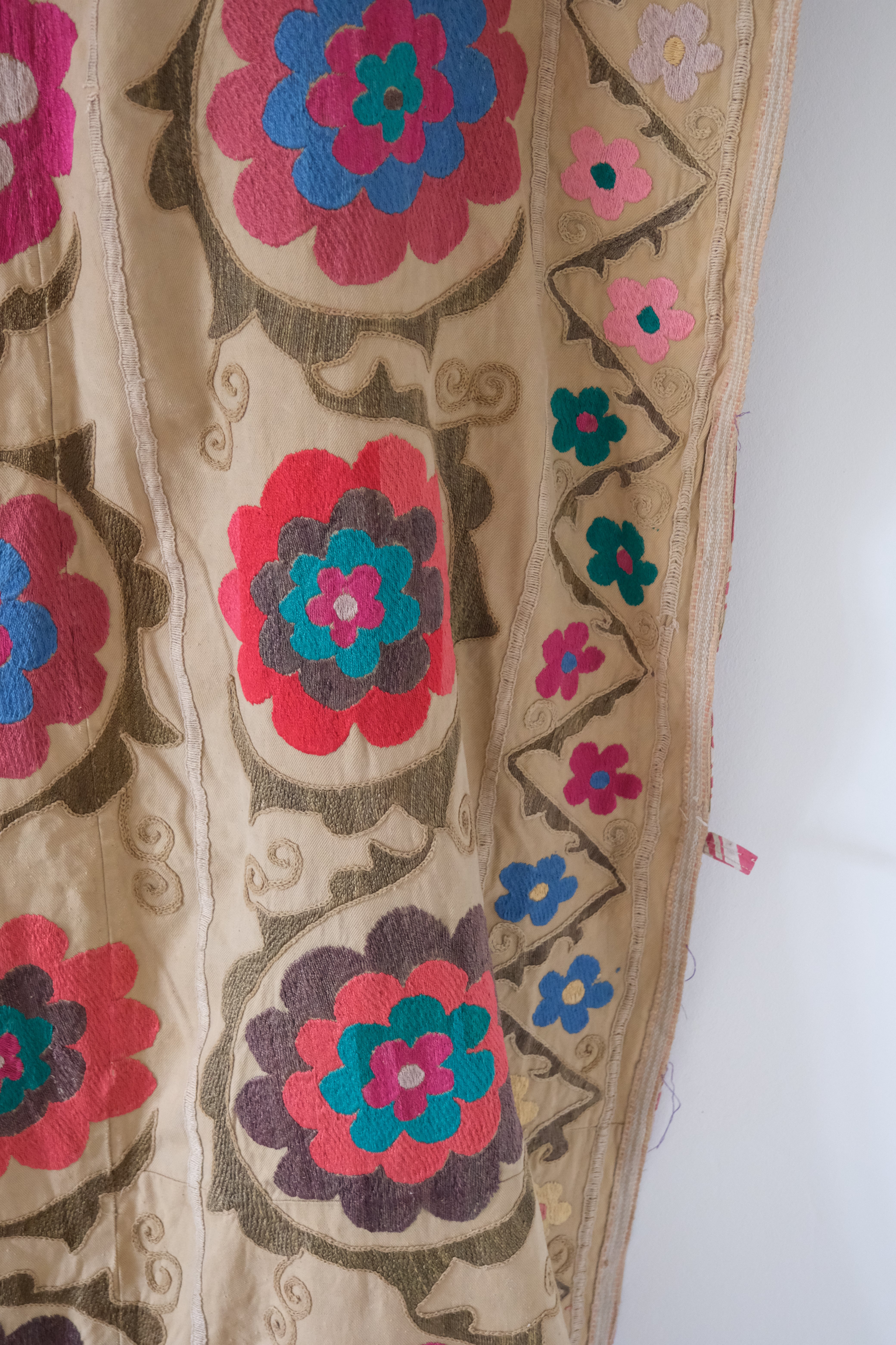 Vintage suzani, embroidered textile and decorative tapestry, large floral design, close-up