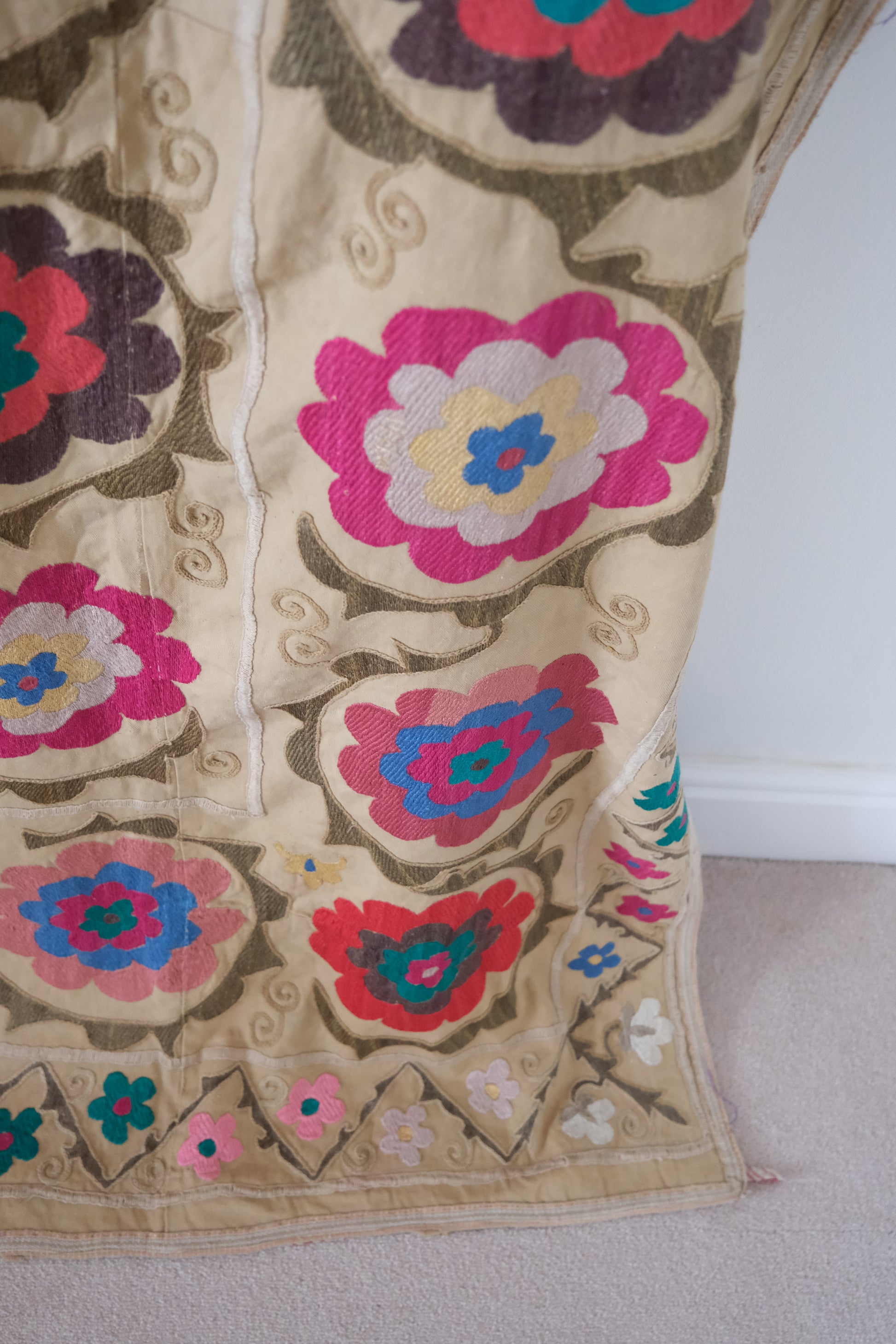 Vintage suzani, embroidered textile and decorative tapestry, large floral design, close-up
