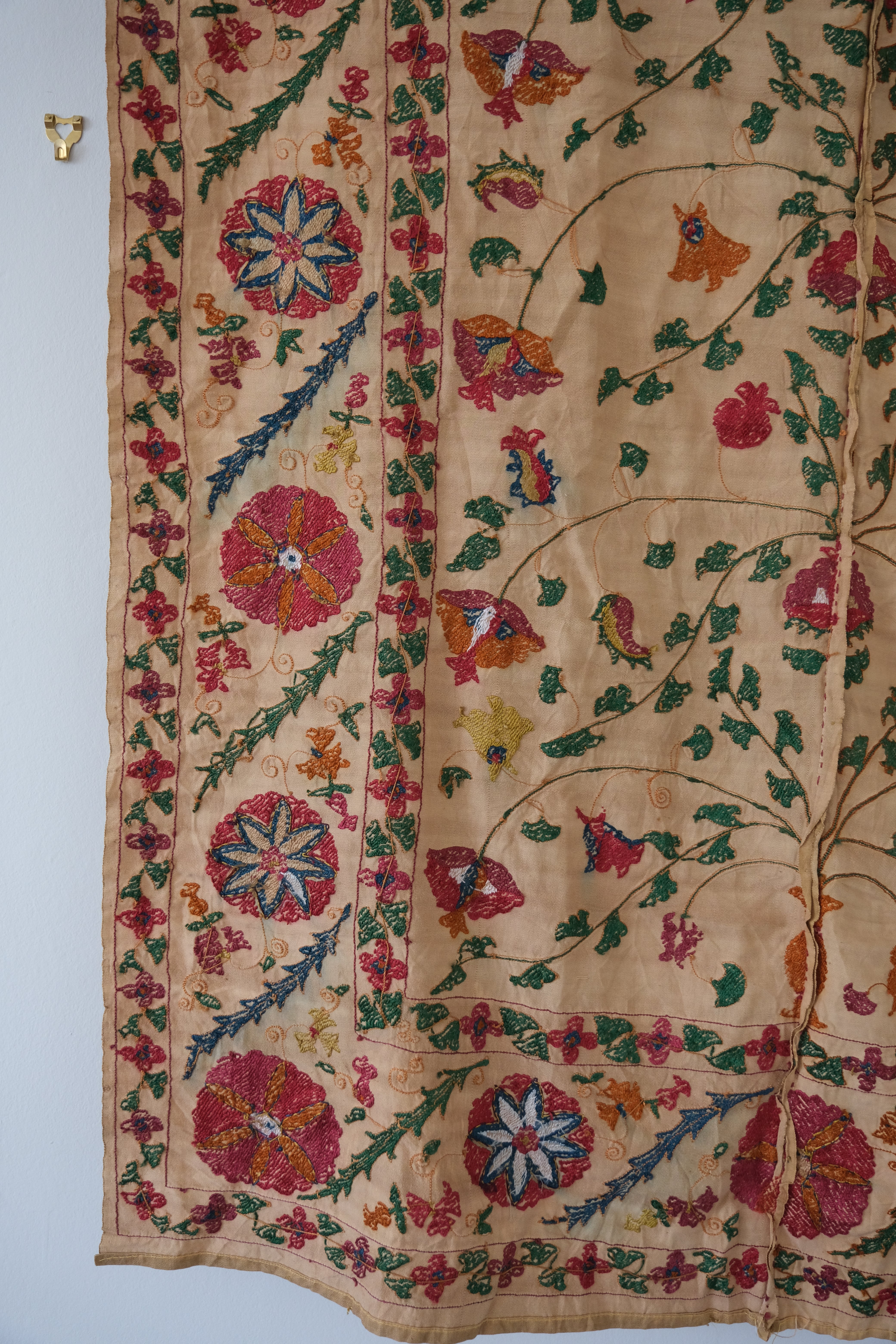Antique suzani wallhanging, embroidered antique textile, camel with pink florals, backside
