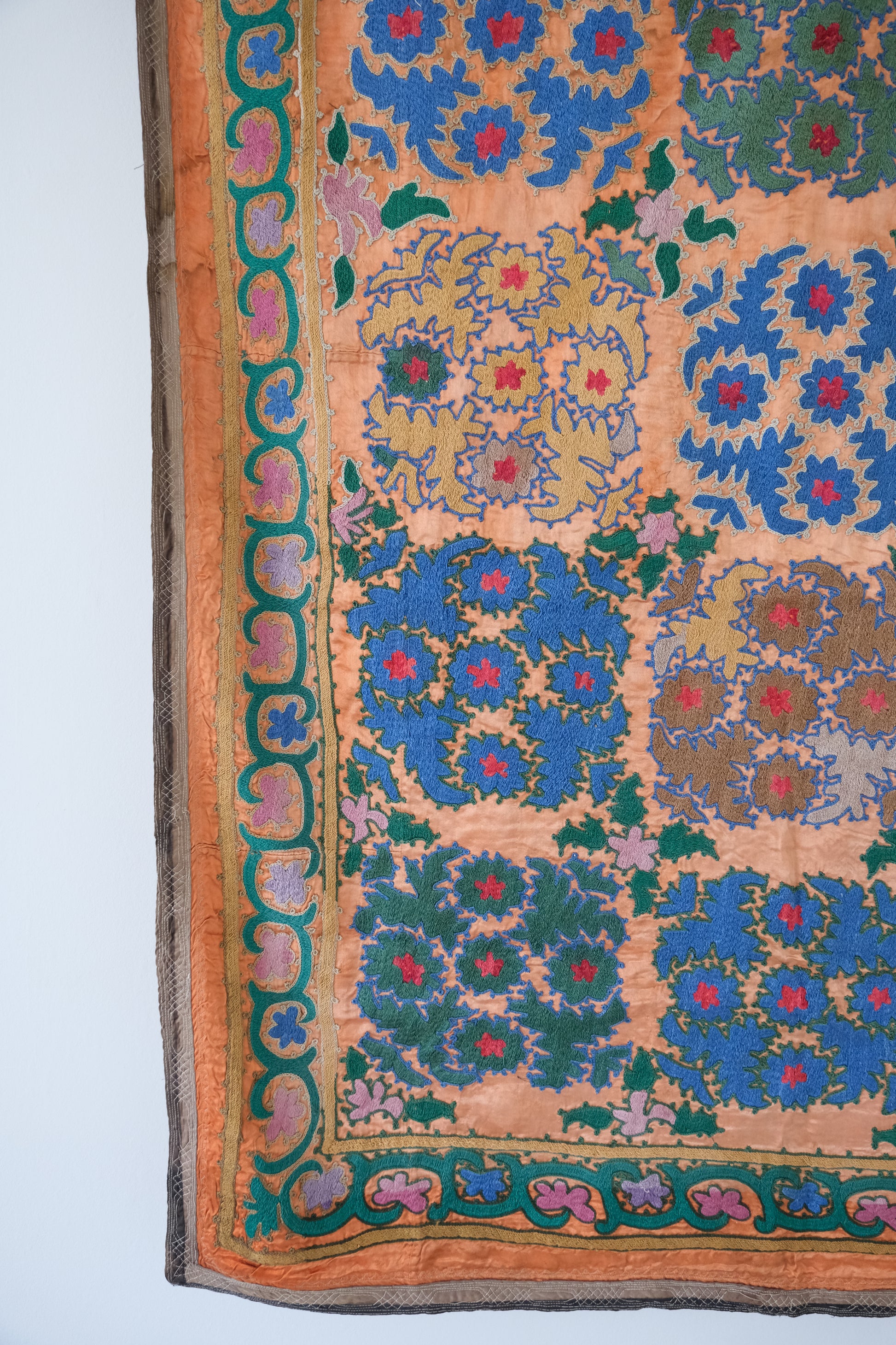 Vintage suzani, silk embroidered textile, orange and floral design
