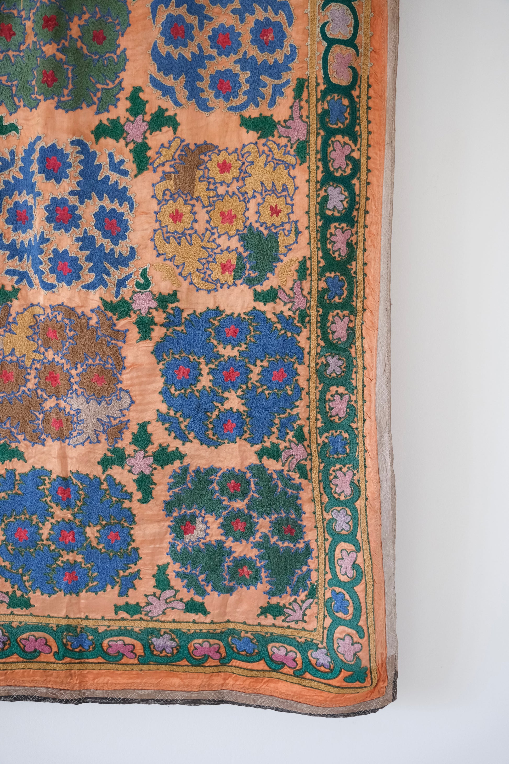 Vintage suzani, silk embroidered textile, orange and floral design