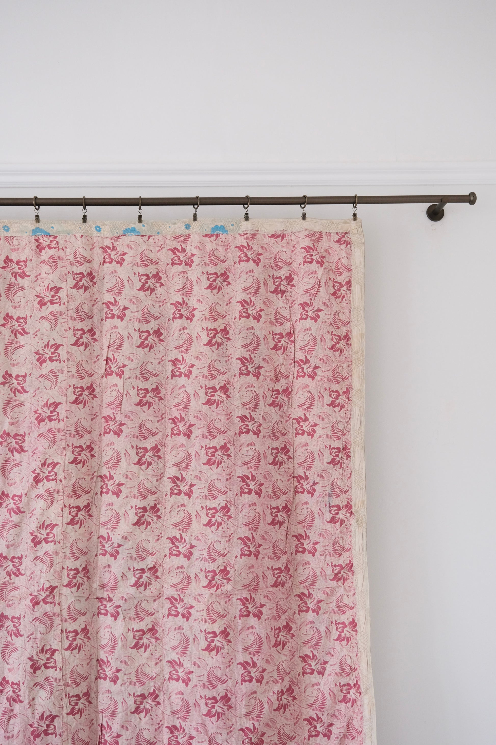 Vintage suzani, decorative embroidered tapestry, pink with geometric and floral design, backside