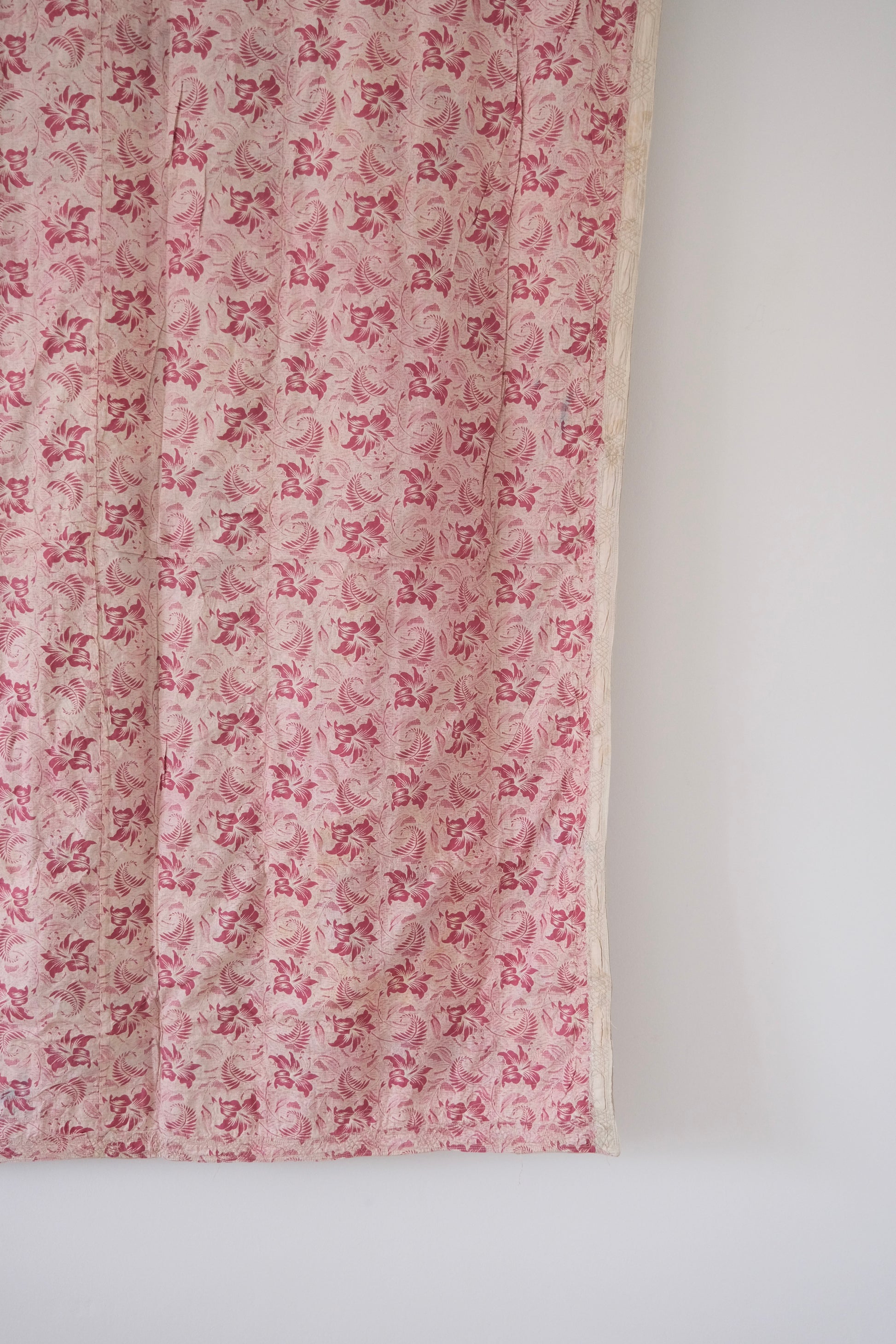 Vintage suzani, decorative embroidered tapestry, pink with geometric and floral design, backside