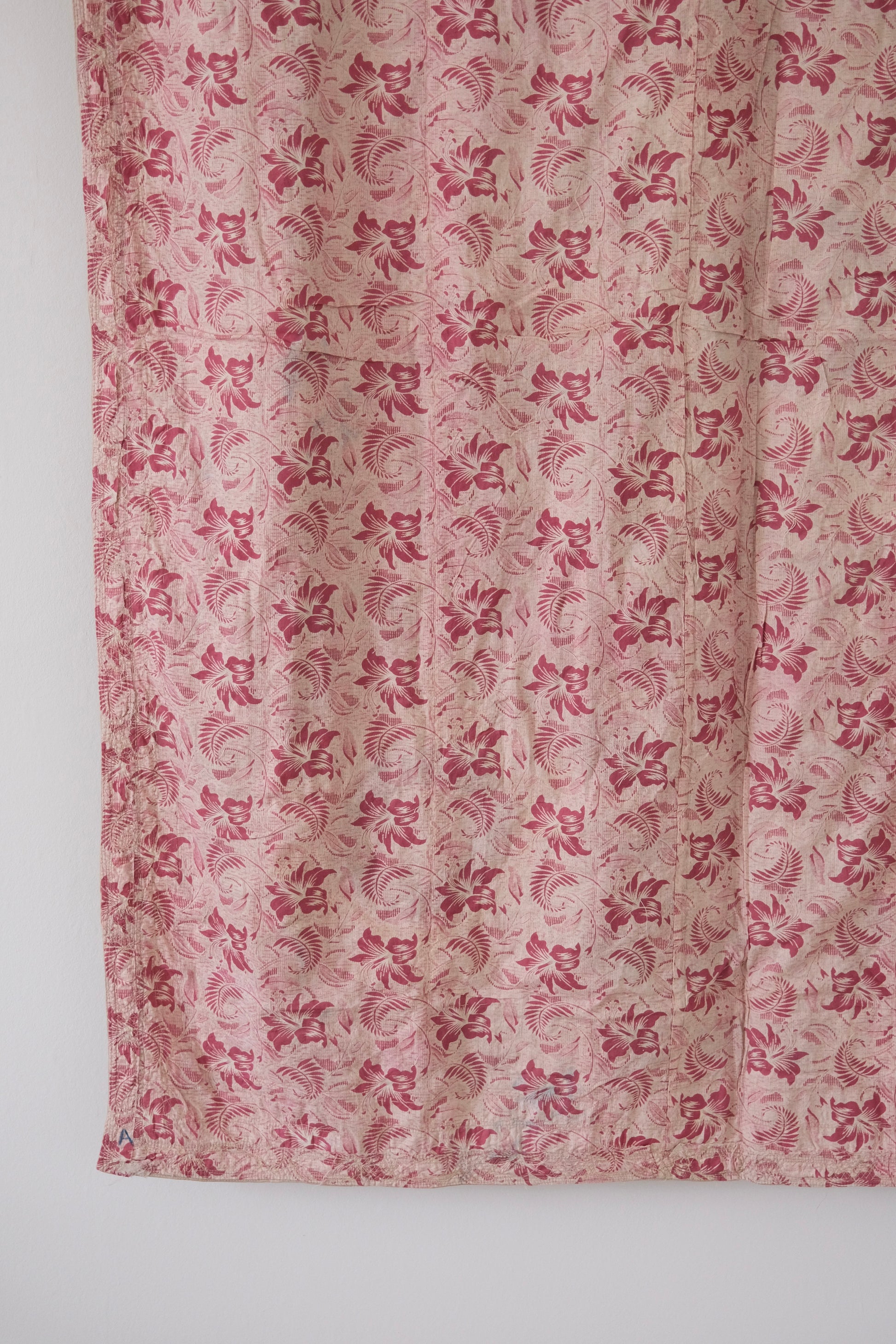 Vintage suzani, decorative embroidered tapestry, pink with geometric and floral design, backside