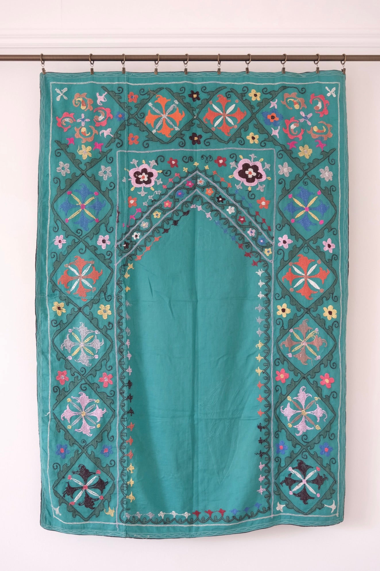 Vintage suzani, colourful embroidered textile, turquoise with flowers, backside