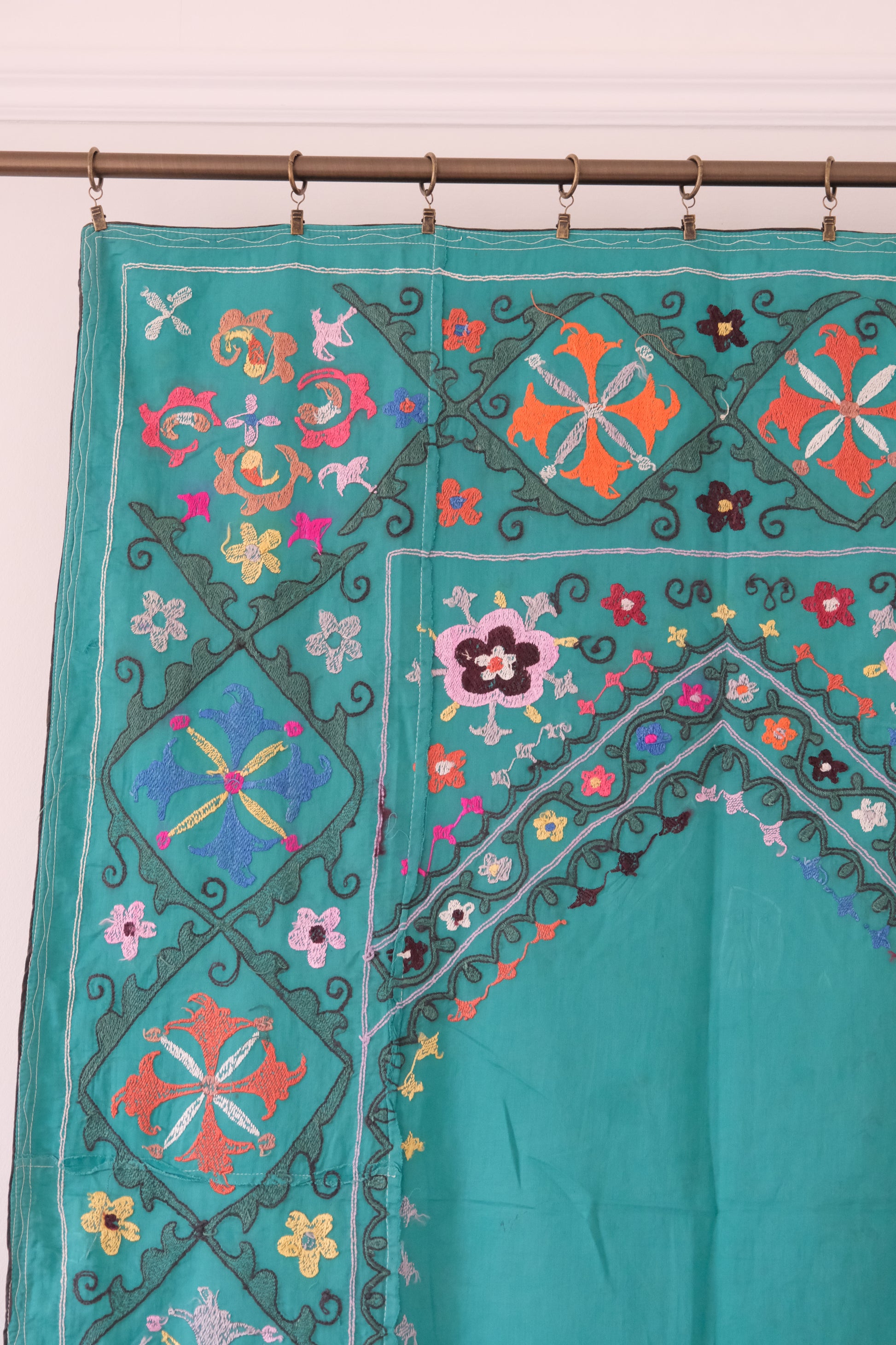 Vintage suzani, colourful embroidered textile, turquoise with flowers, backside