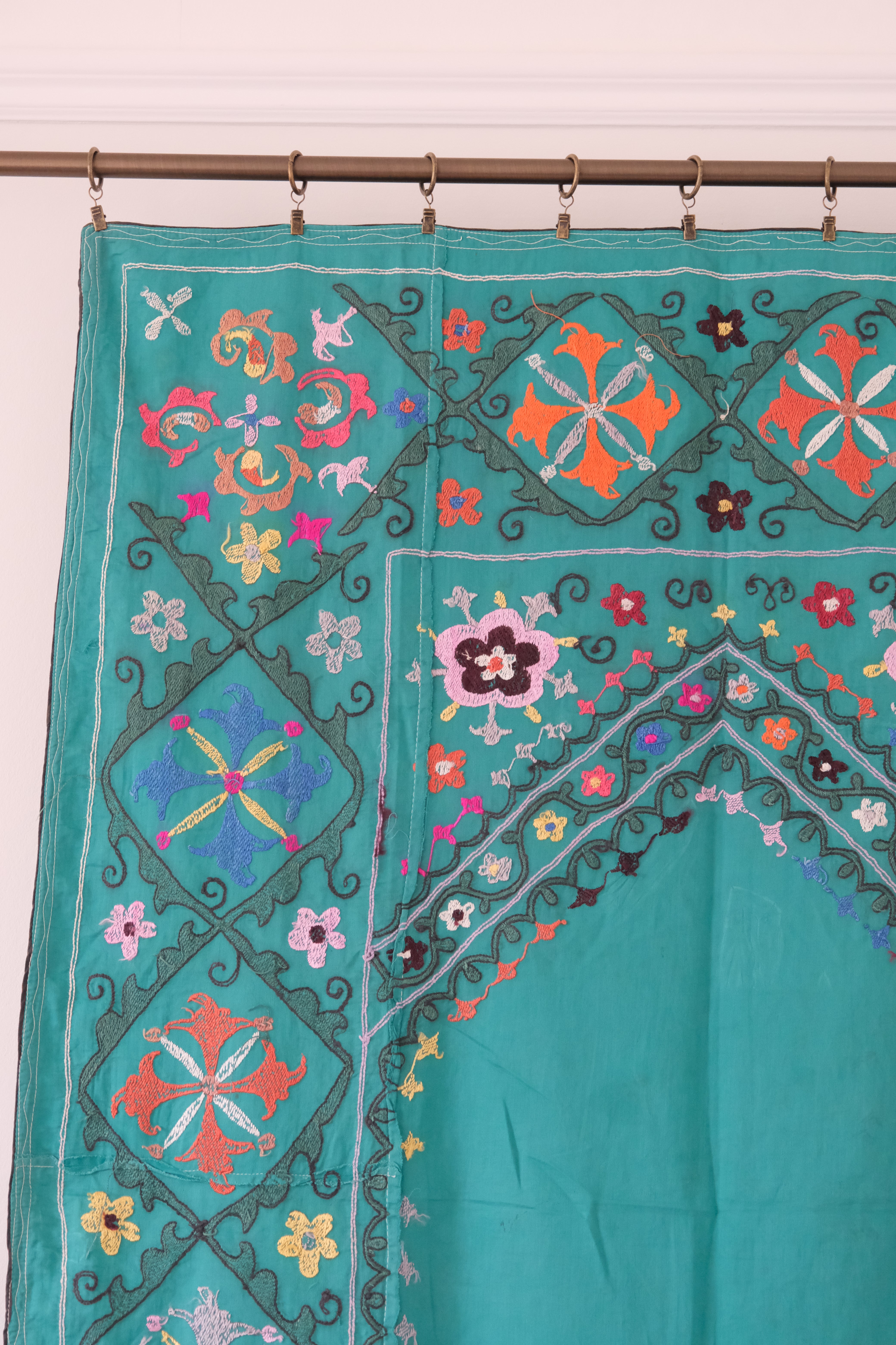 Vintage suzani, colourful embroidered textile, turquoise with flowers, backside