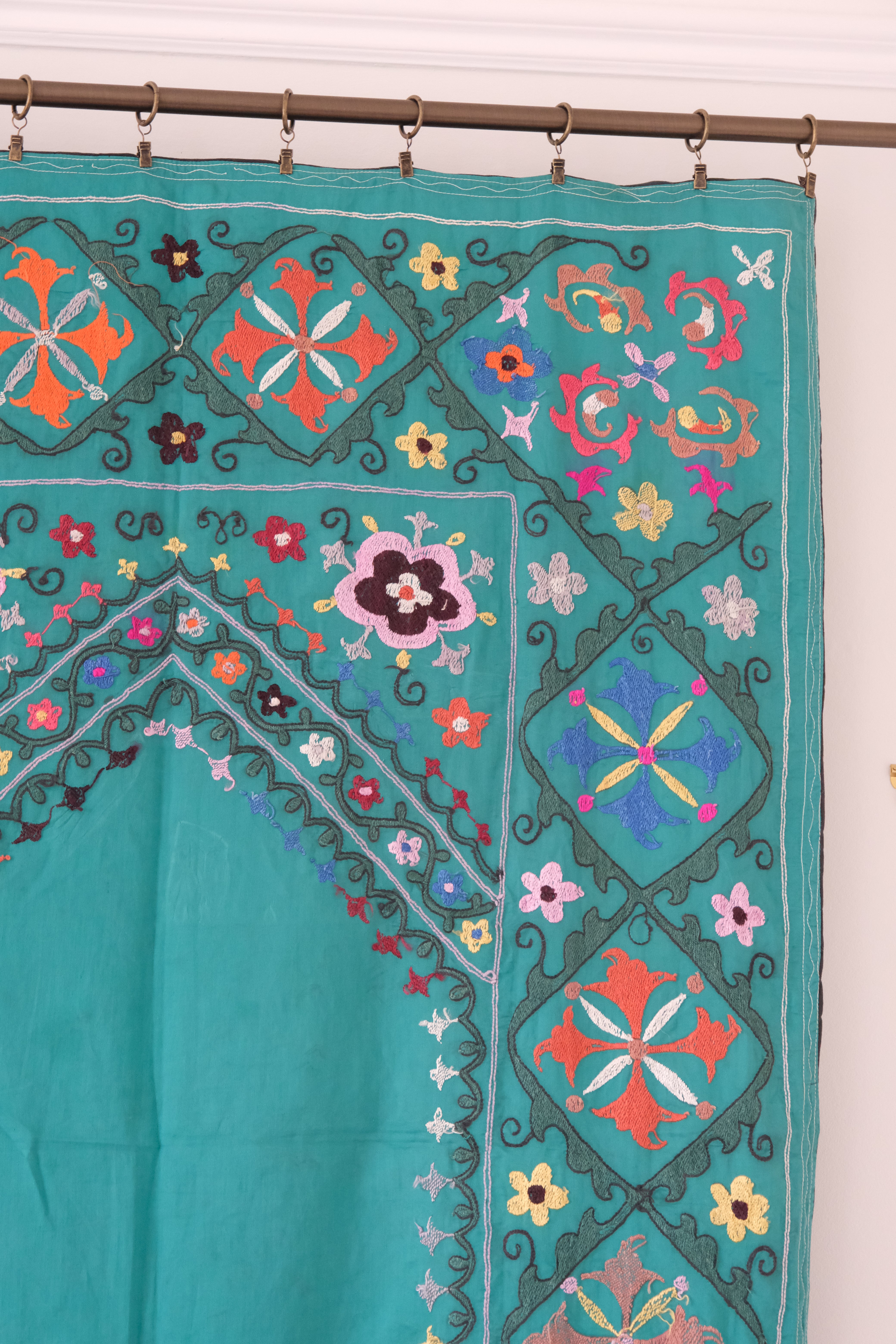 Vintage suzani, colourful embroidered textile, turquoise with flowers, backside