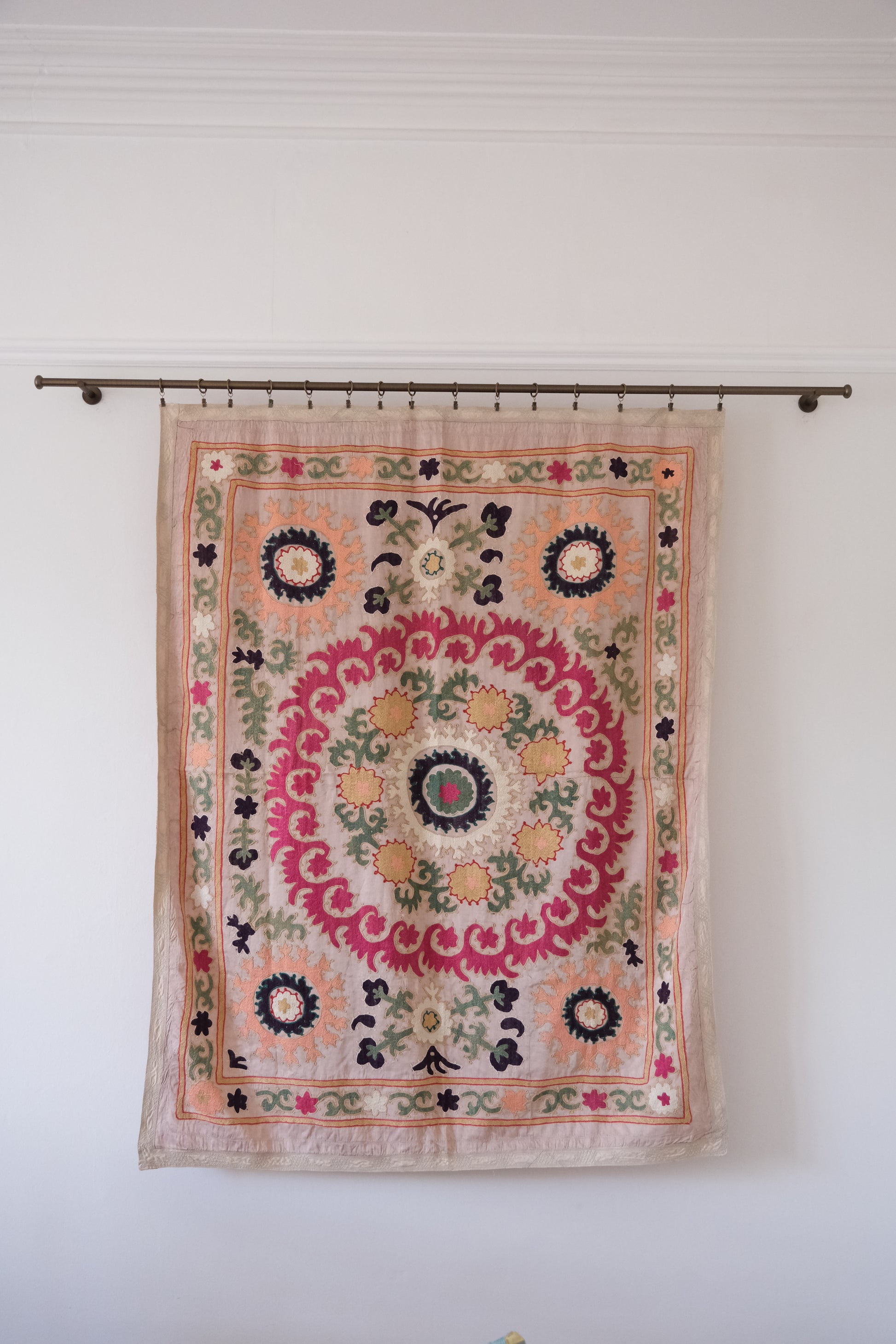 Vintage suzani, decorative embroidered tapestry, pink with geometric and floral design