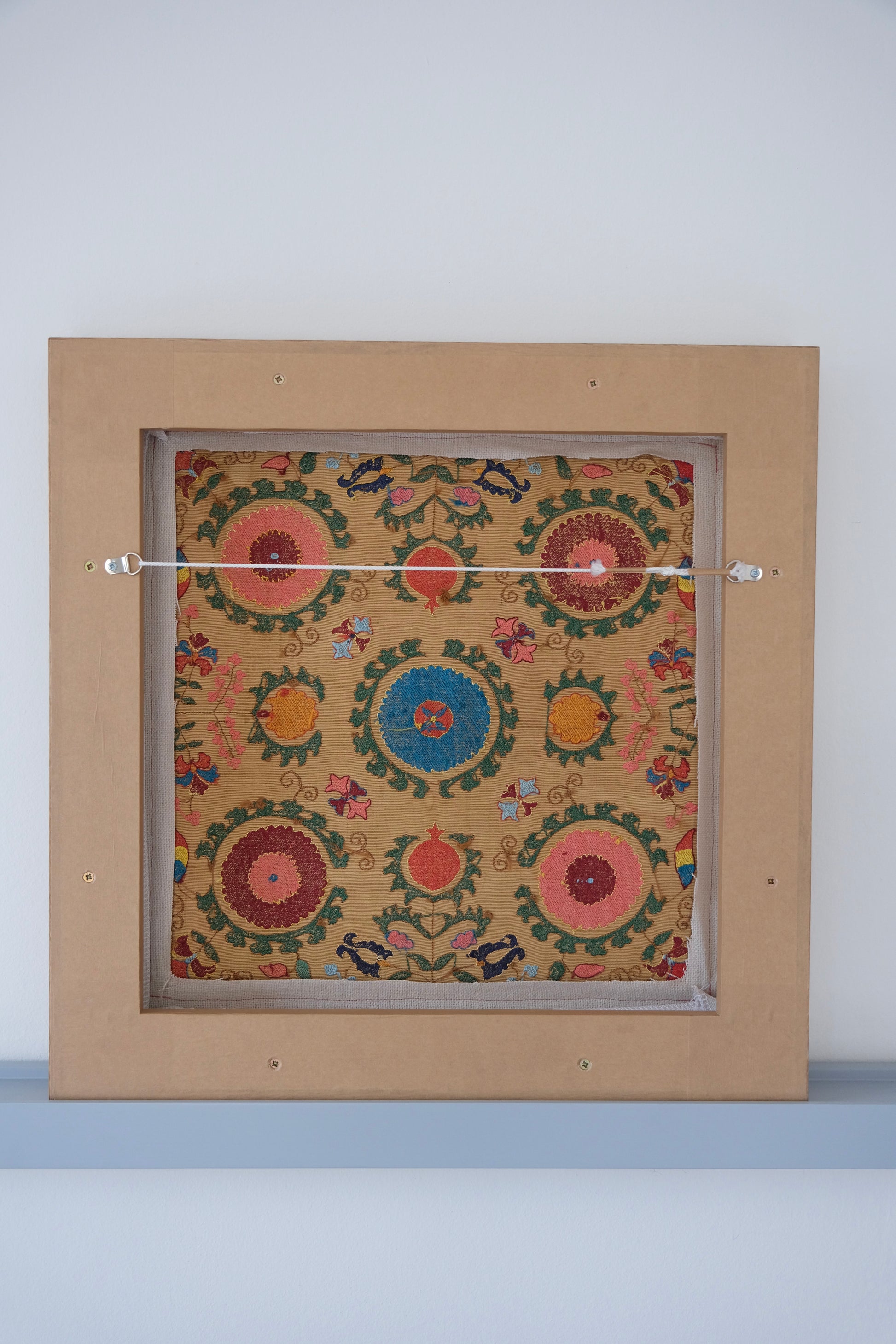Framed antique suzani, framed textile, embroidered textile art, wooden frame, backside